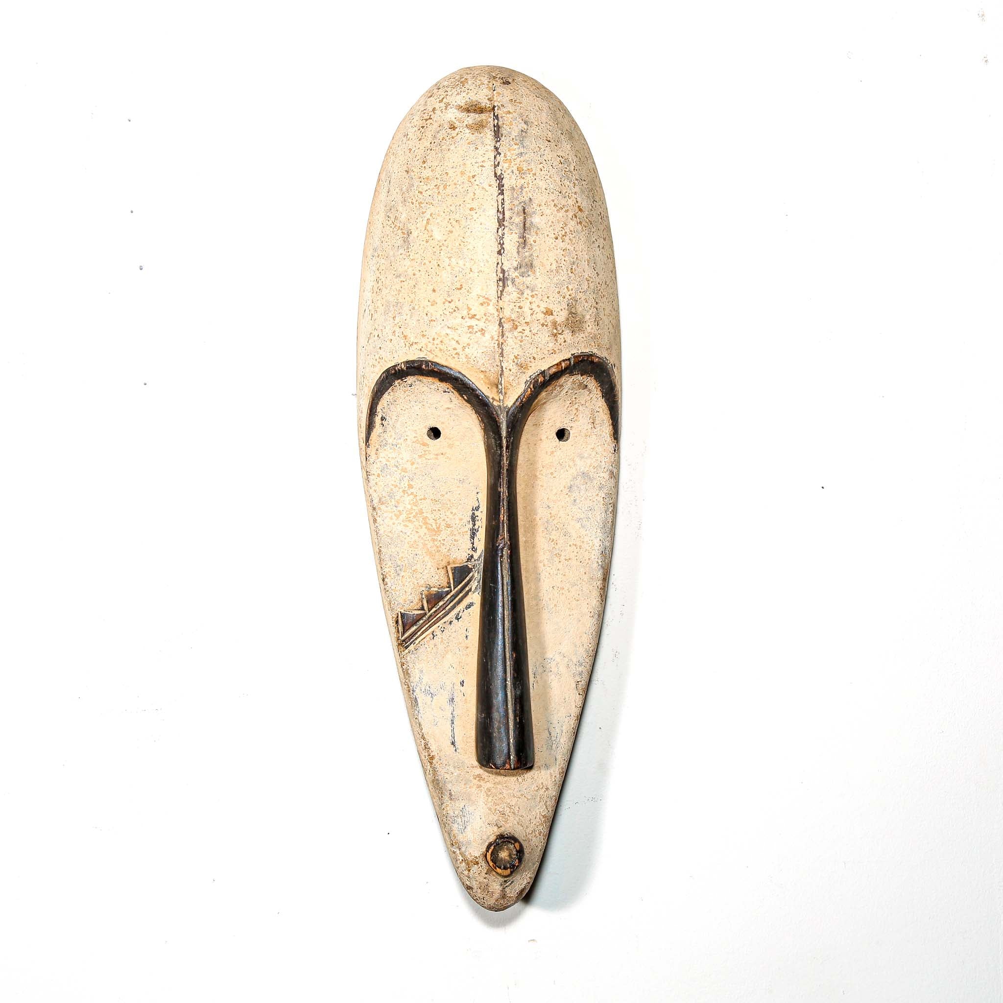 Authentic African mask to purchase online with colorful designs on a white background