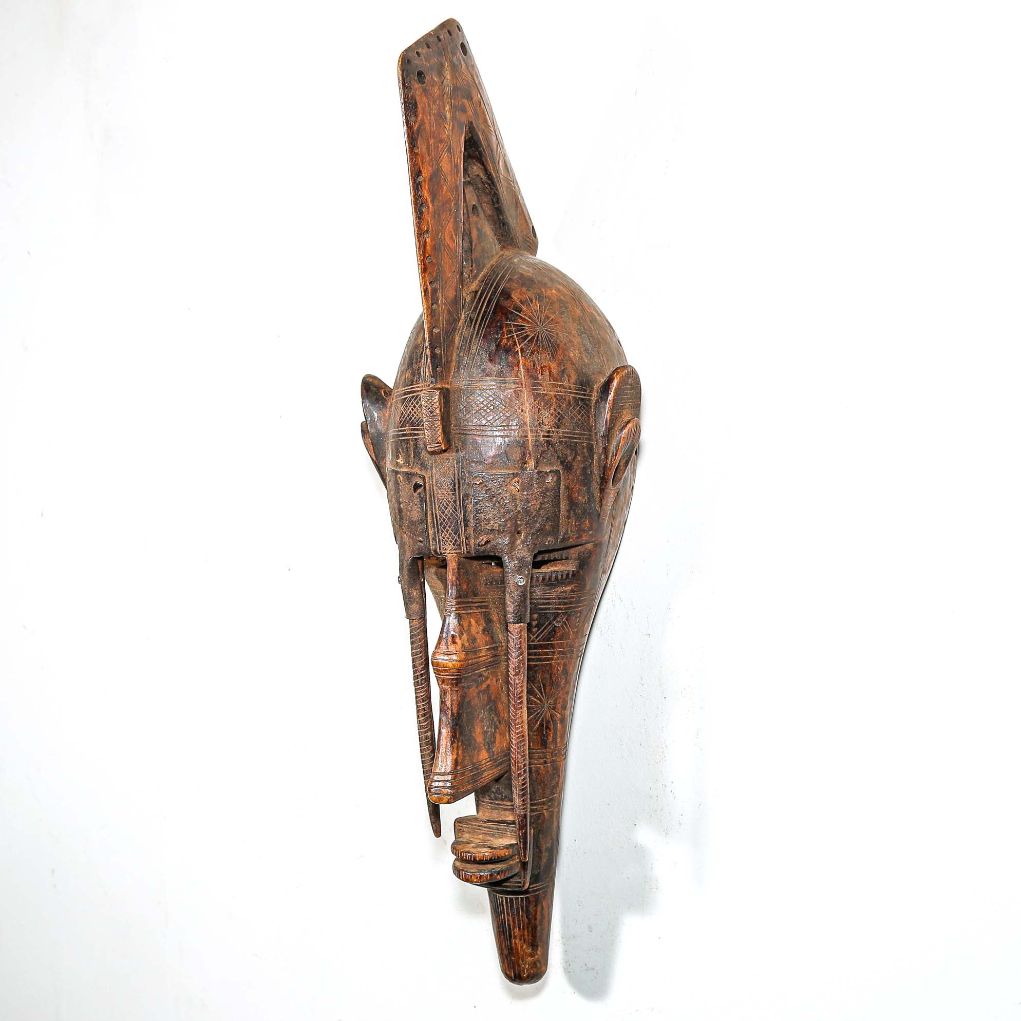 African Wooden and metal mask with intricate carvings for sale online