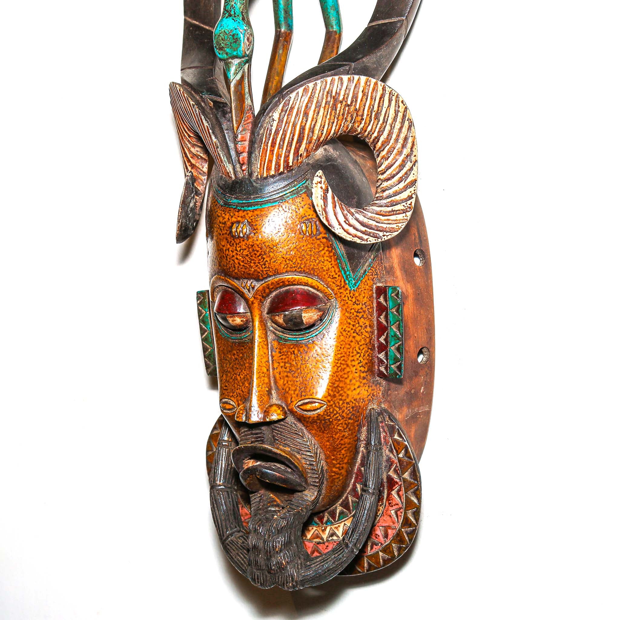 Authentic African mask to purchase online with colorful designs on a white background