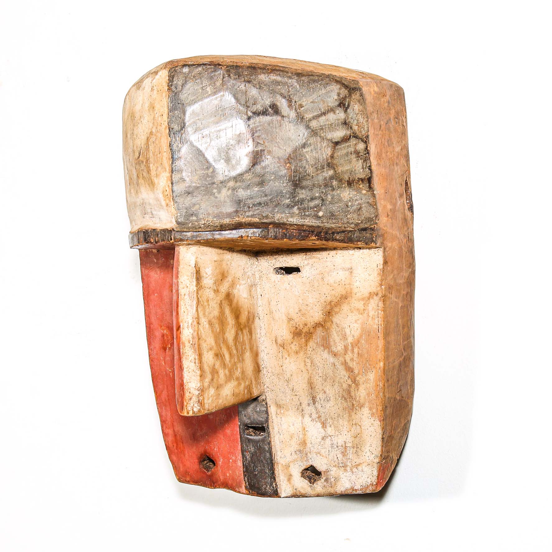 vintage Wooden African mask for sale with a checkered pattern on a white background