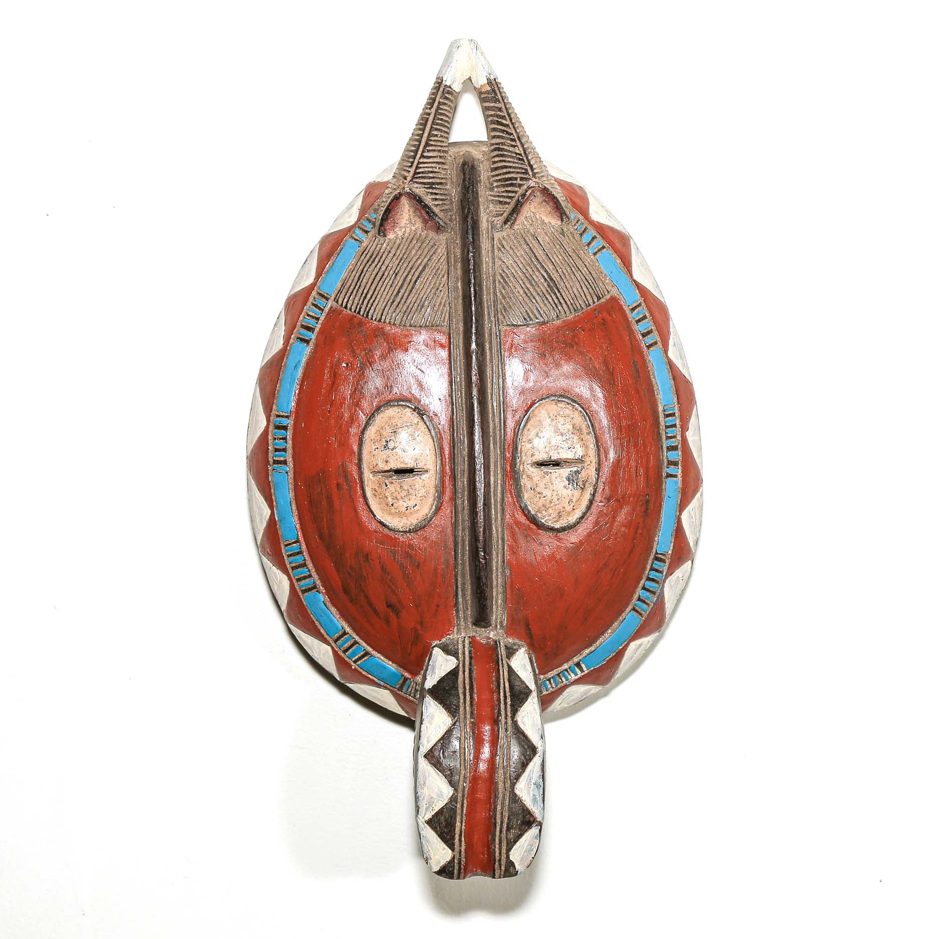 Traditional mask with red, blue, and silver colors on a white background. Colorful African art for sale