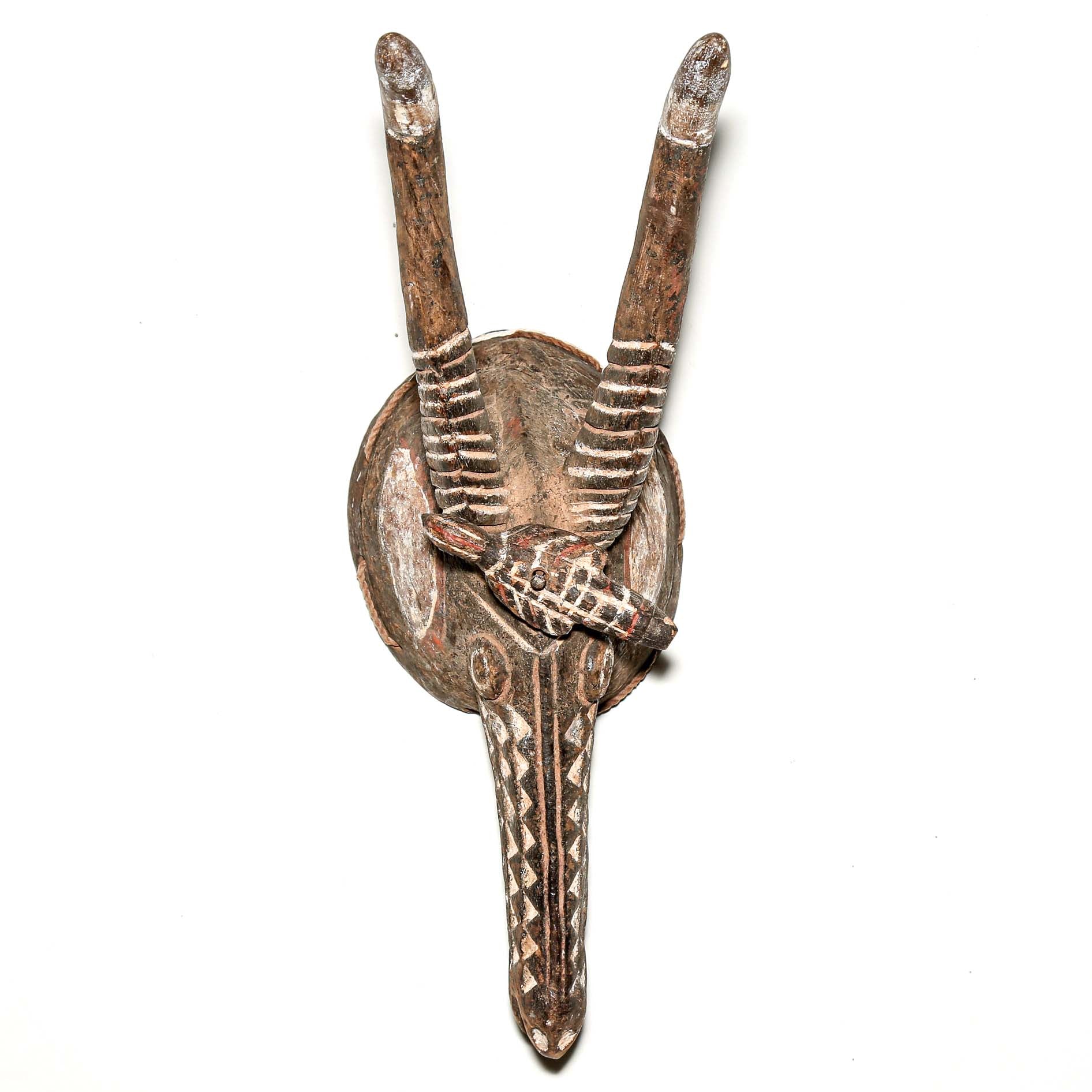 traditional tribal art mask with antlers on a white background for sale