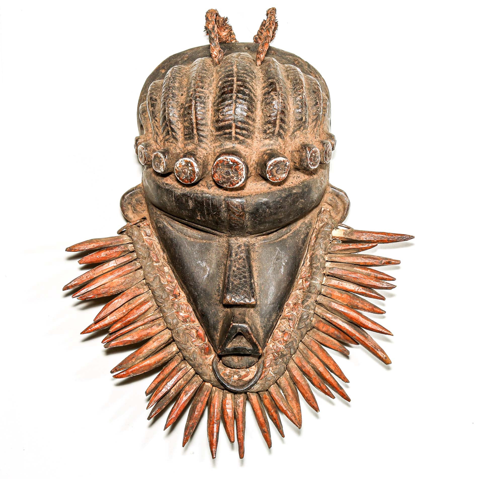 authentic Wooden tribal mask from Africa on a white wall