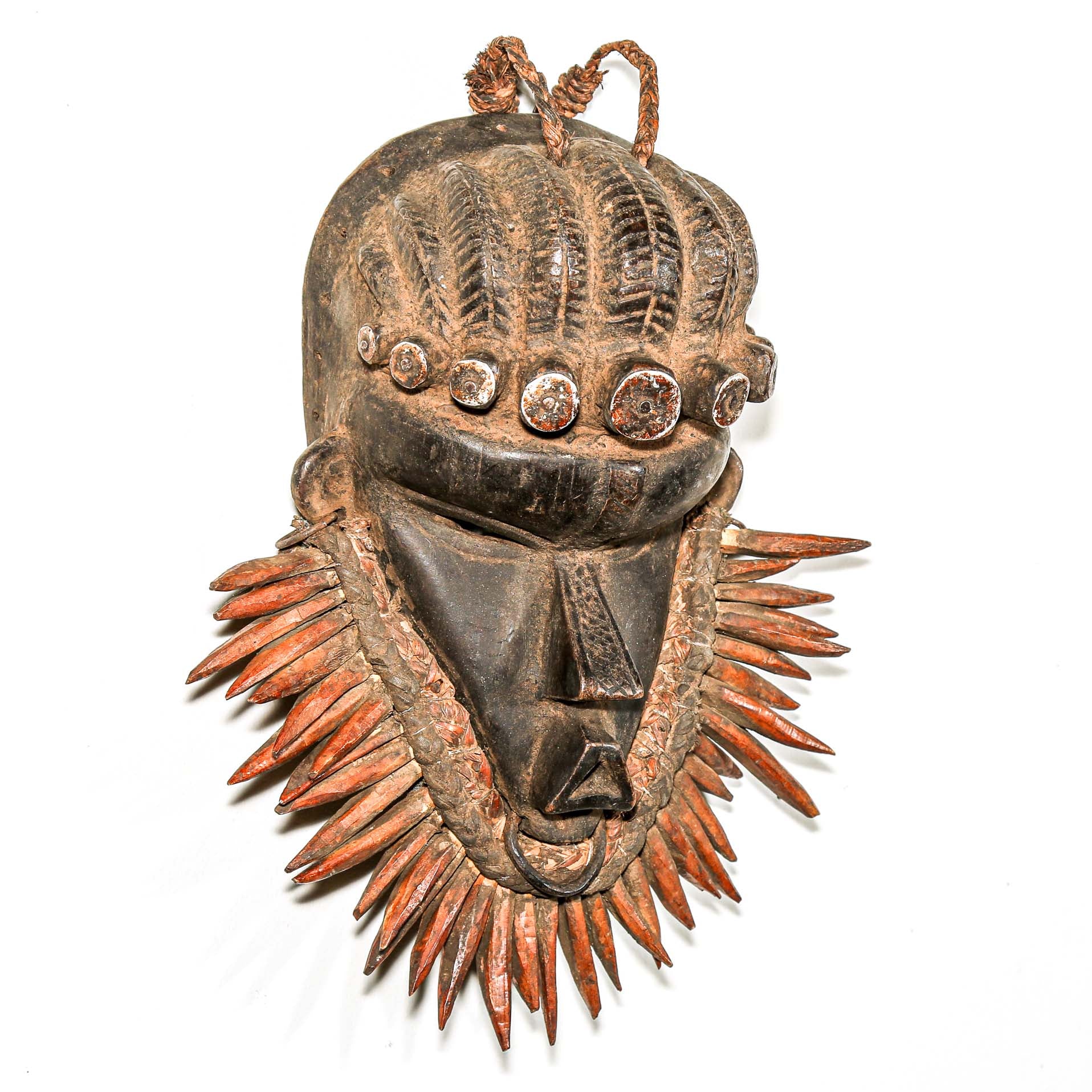 authentic Wooden tribal mask from Africa on a white wall