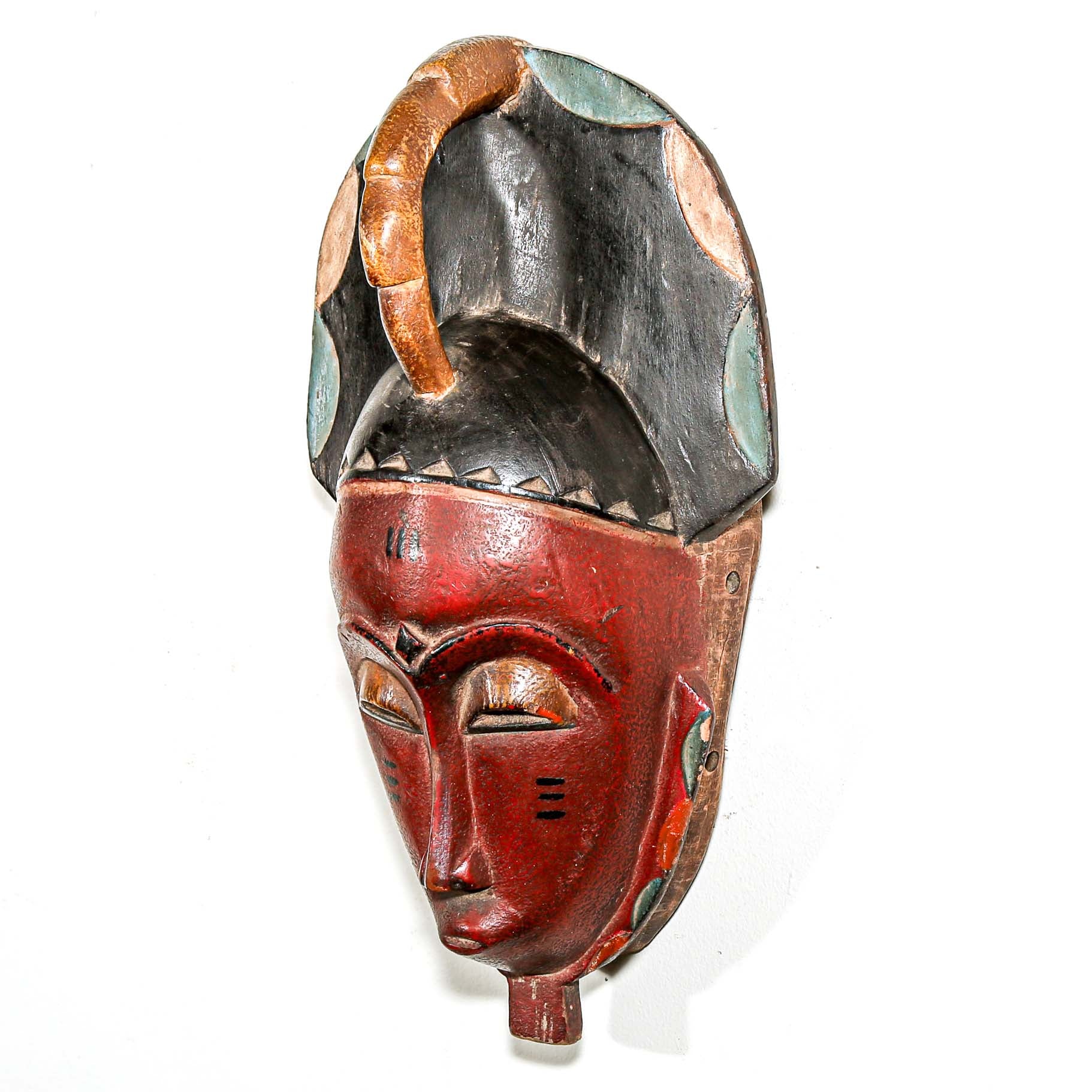 Red collectable African tribal mask for modern interior design ideas