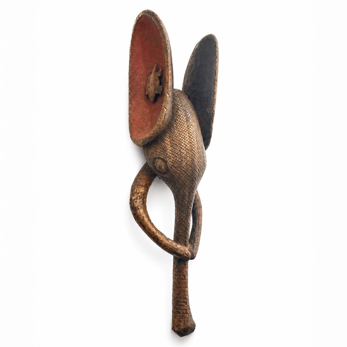 Decorative wall mask of a elephant from Africa made from wood and metal with a unique design on a white background