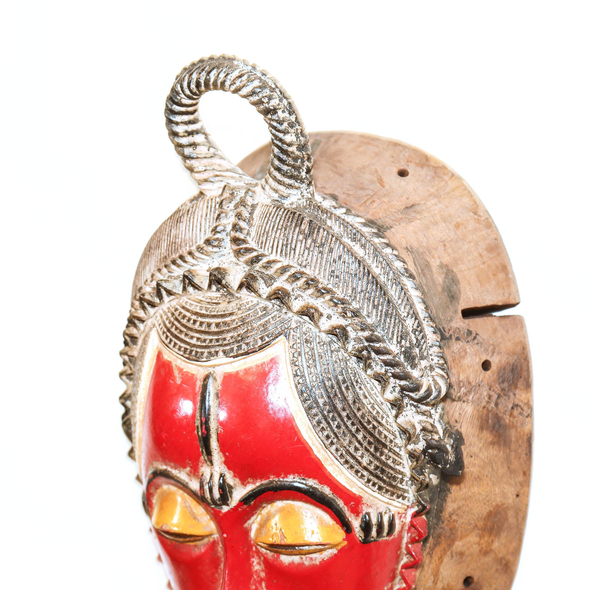 Traditional Baule mask from Ivory Coast with red surface
