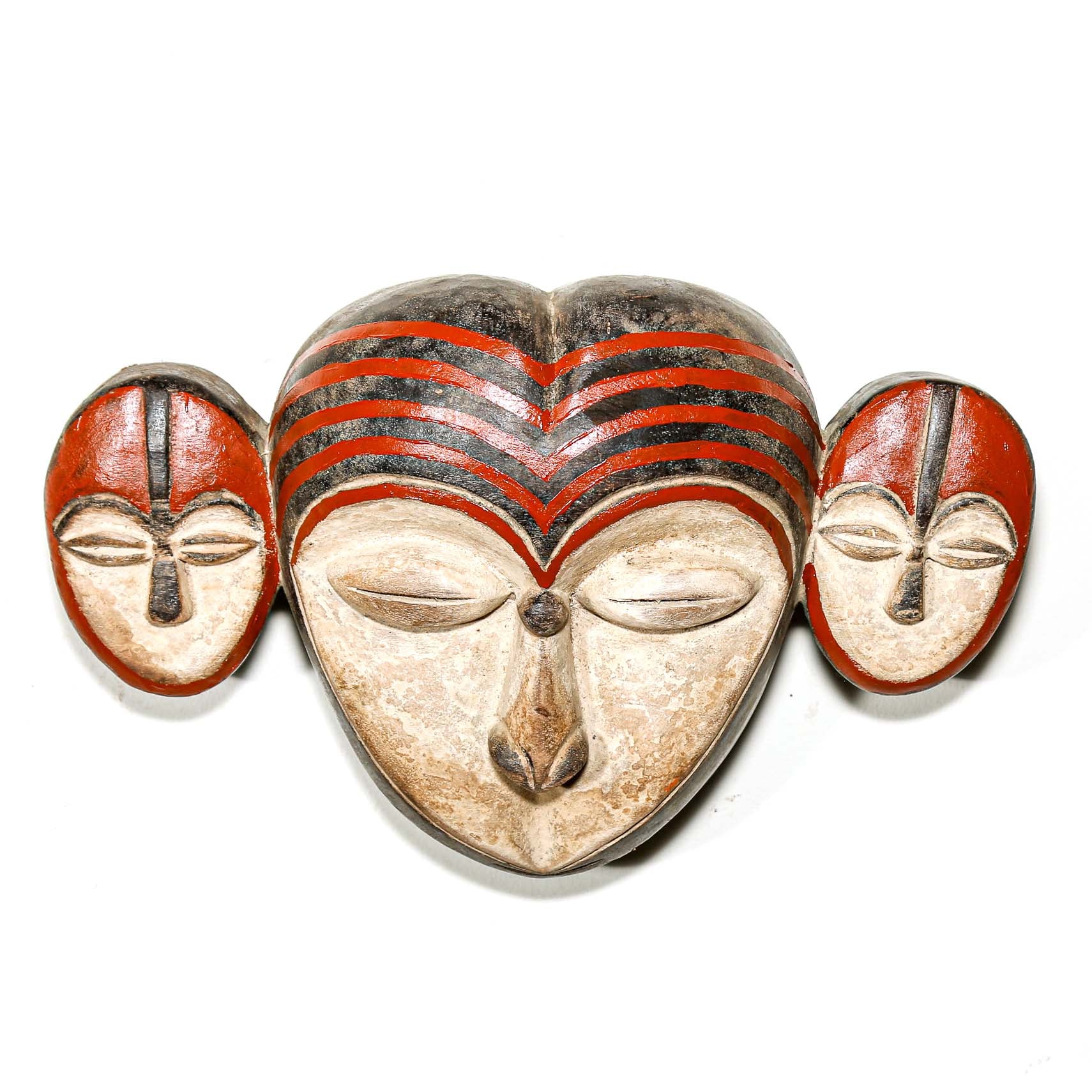 Decorative mask with heart shape and facial features on a white background