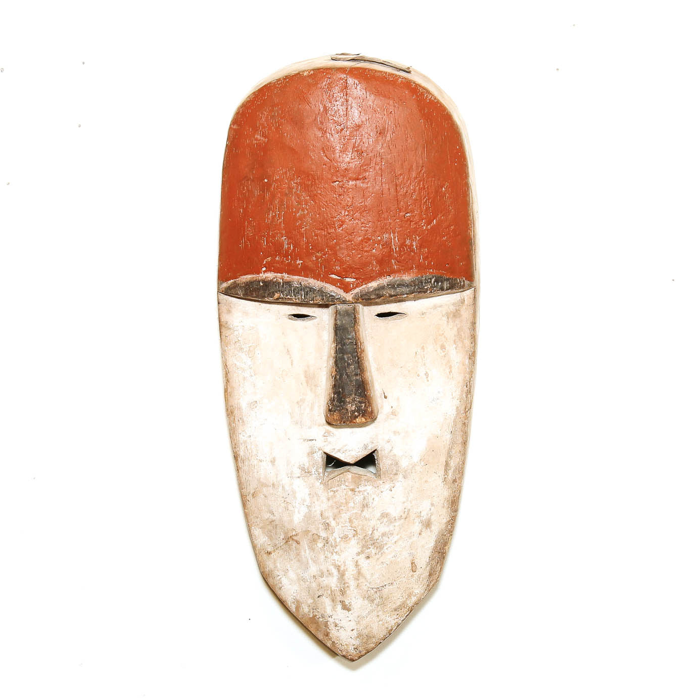 Red and white Pende style mask from the D.R. Congo