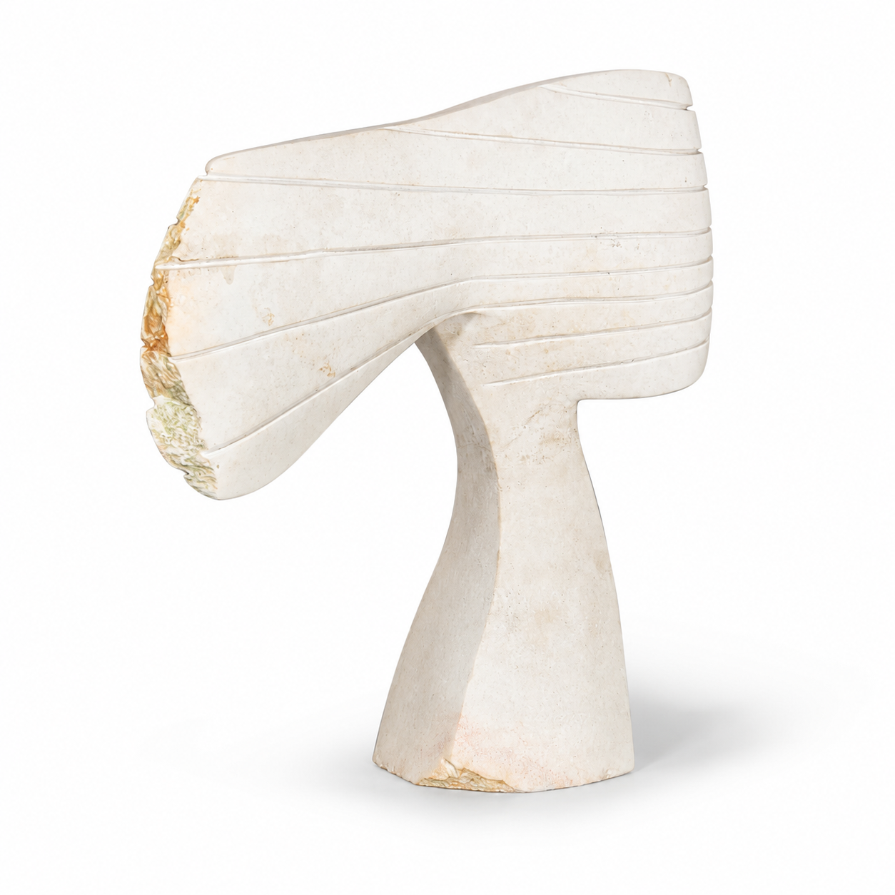 White stone abstract sculpture of a woman's face with hair blowing in the wind on a white background