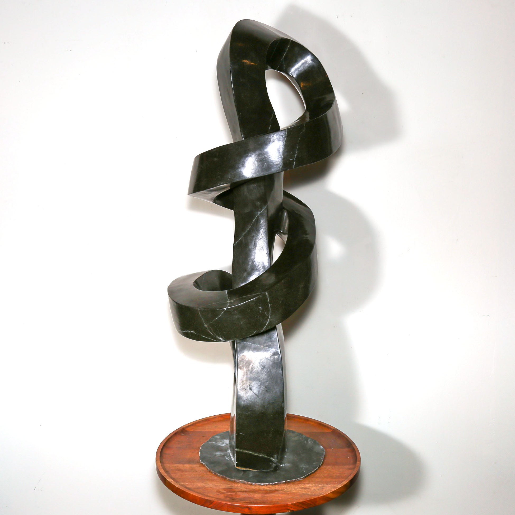 "Continuum" Abstract Sculpture by D. Musekiwa showing carved stone wrapped in knots