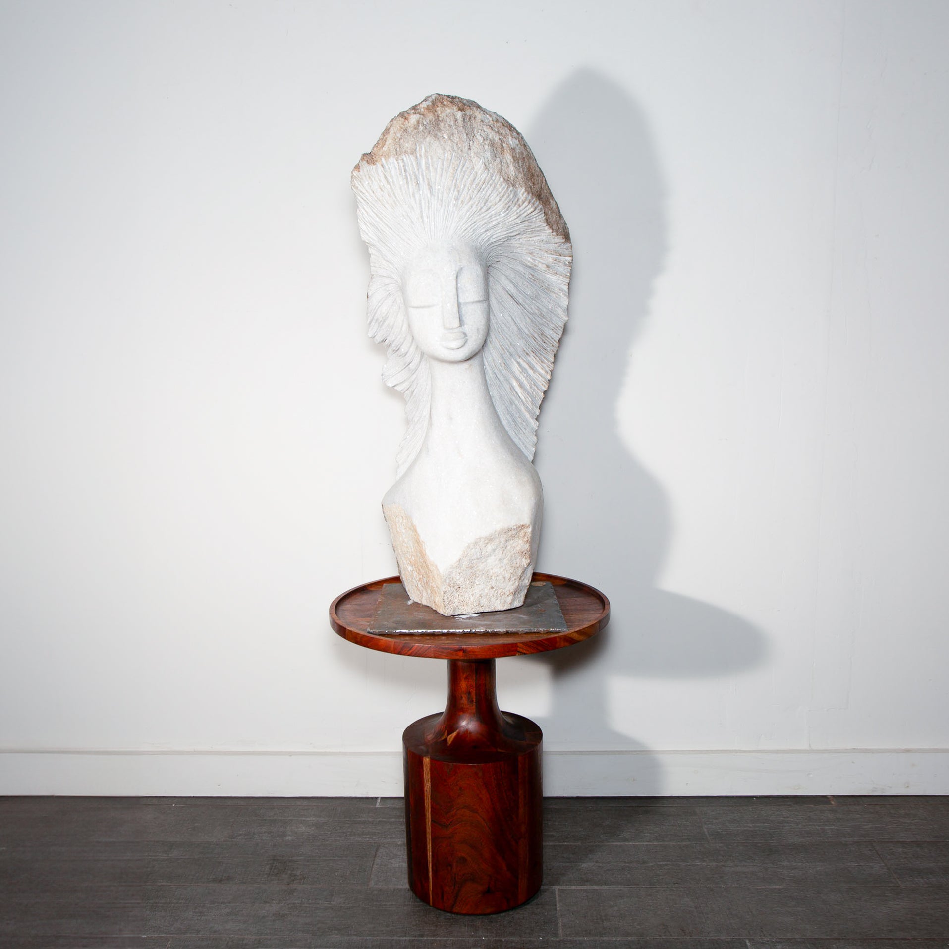 white stone sculpture on a side table
