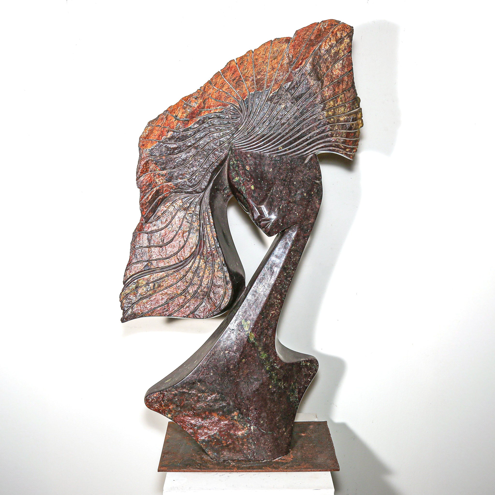 Purple Stone Sculpture of a Woman Titled "Windswept" by Lovemore Bonjisi