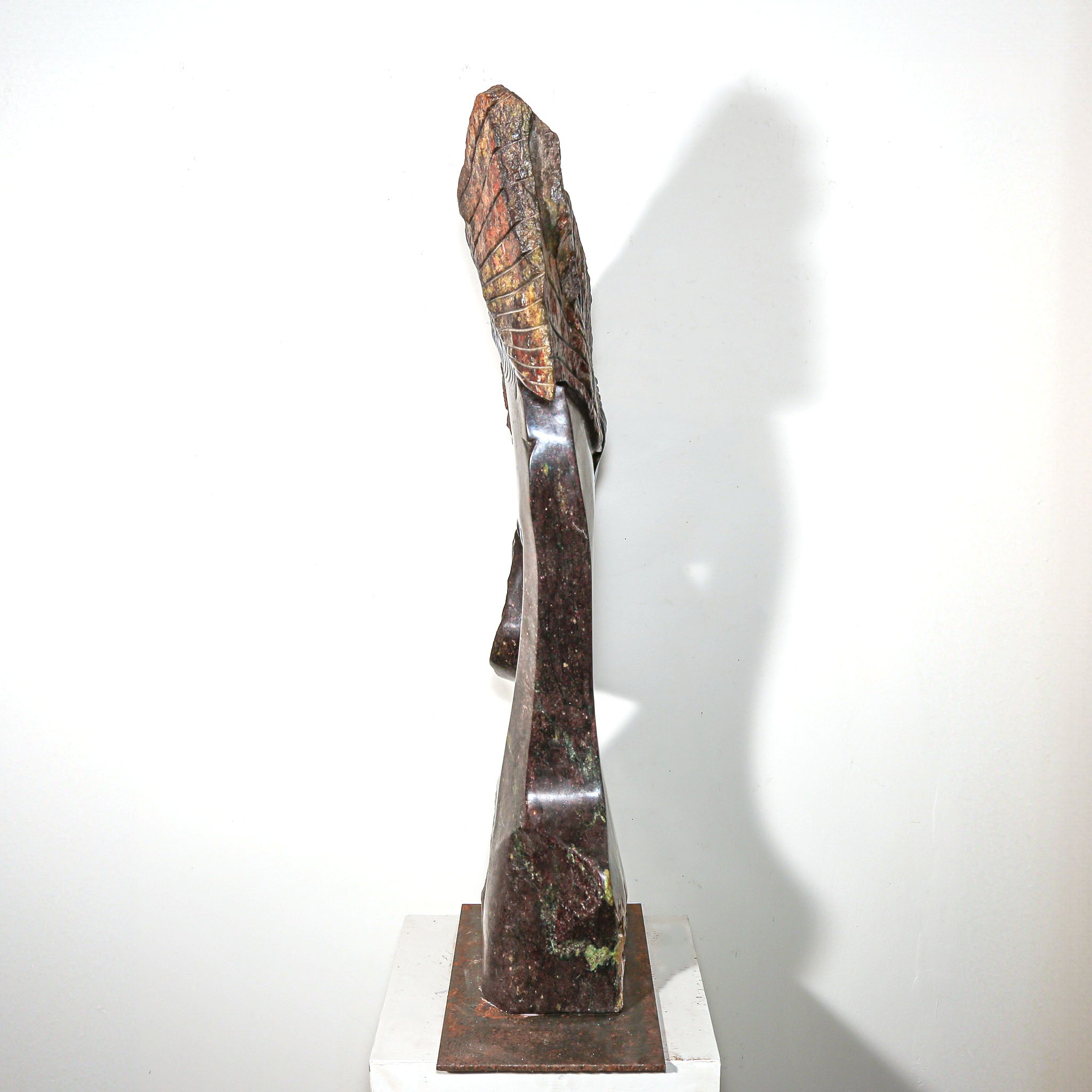 Purple Stone Sculpture of a Woman Titled "Windswept" by Lovemore Bonjisi hand carved stone statue