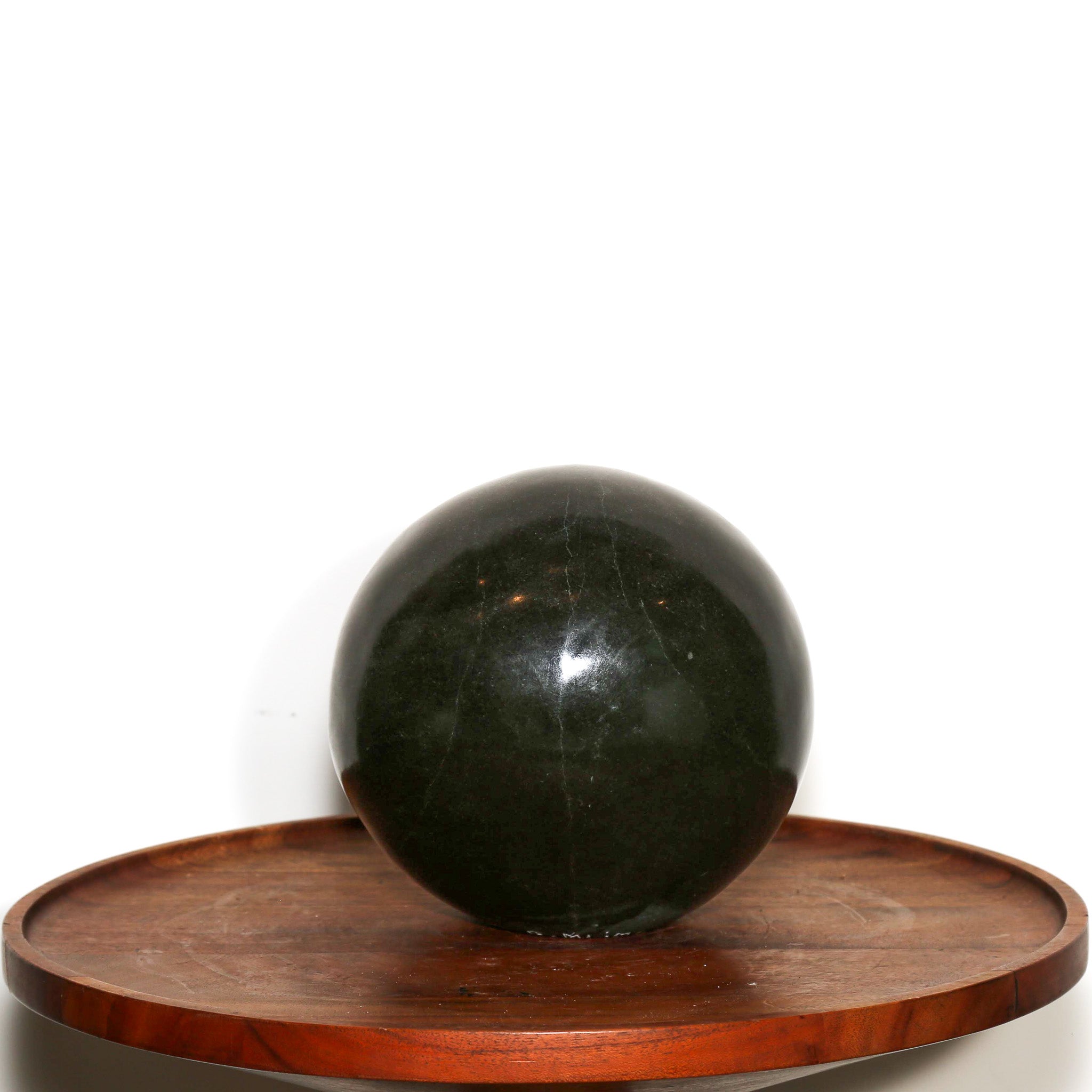"Man in the Moon" Abstract Sculpture. Polish sphere of black stone with a carved abstract face