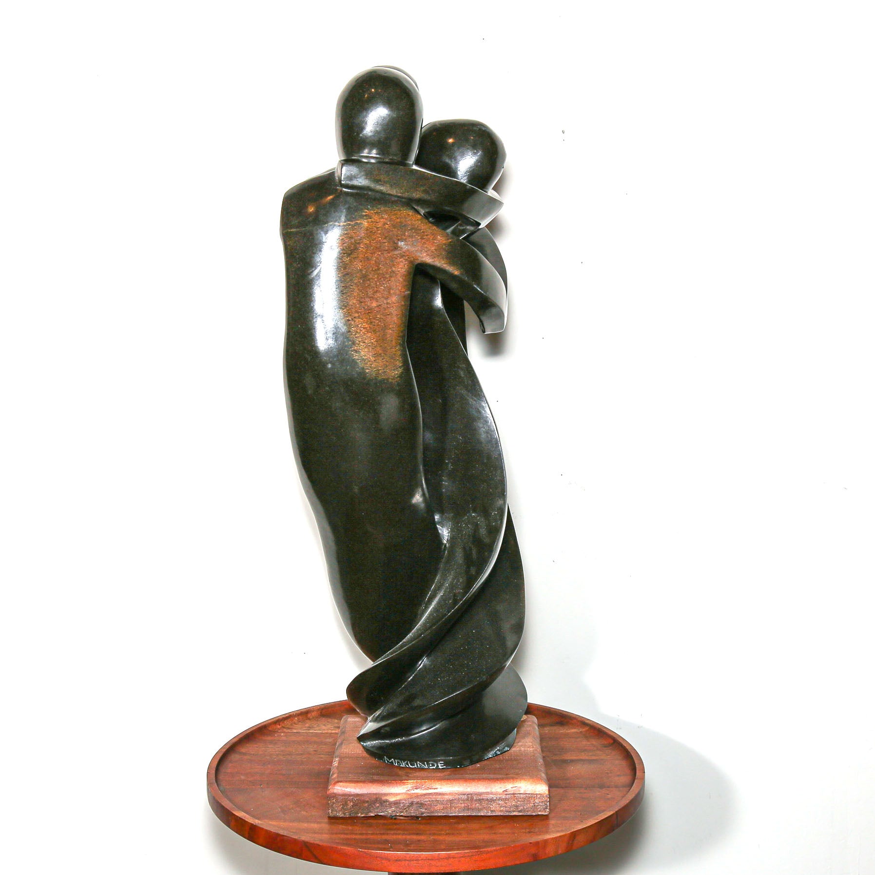 Black Sculpture of three family members hugging
