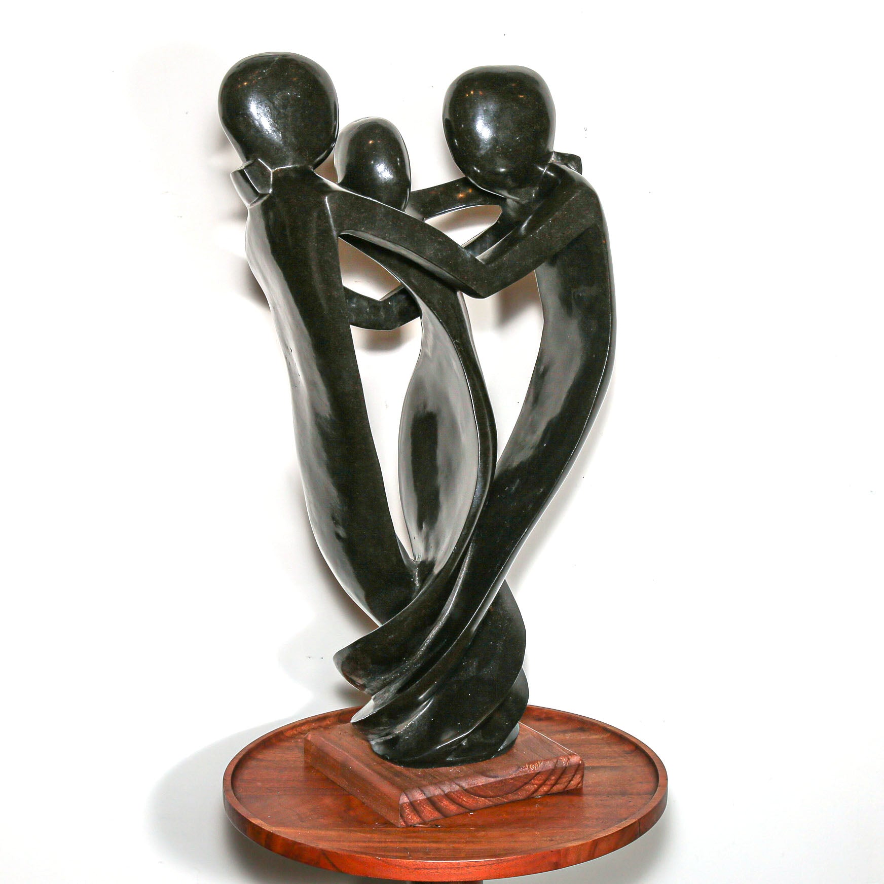 Black Sculpture of three family members hugging