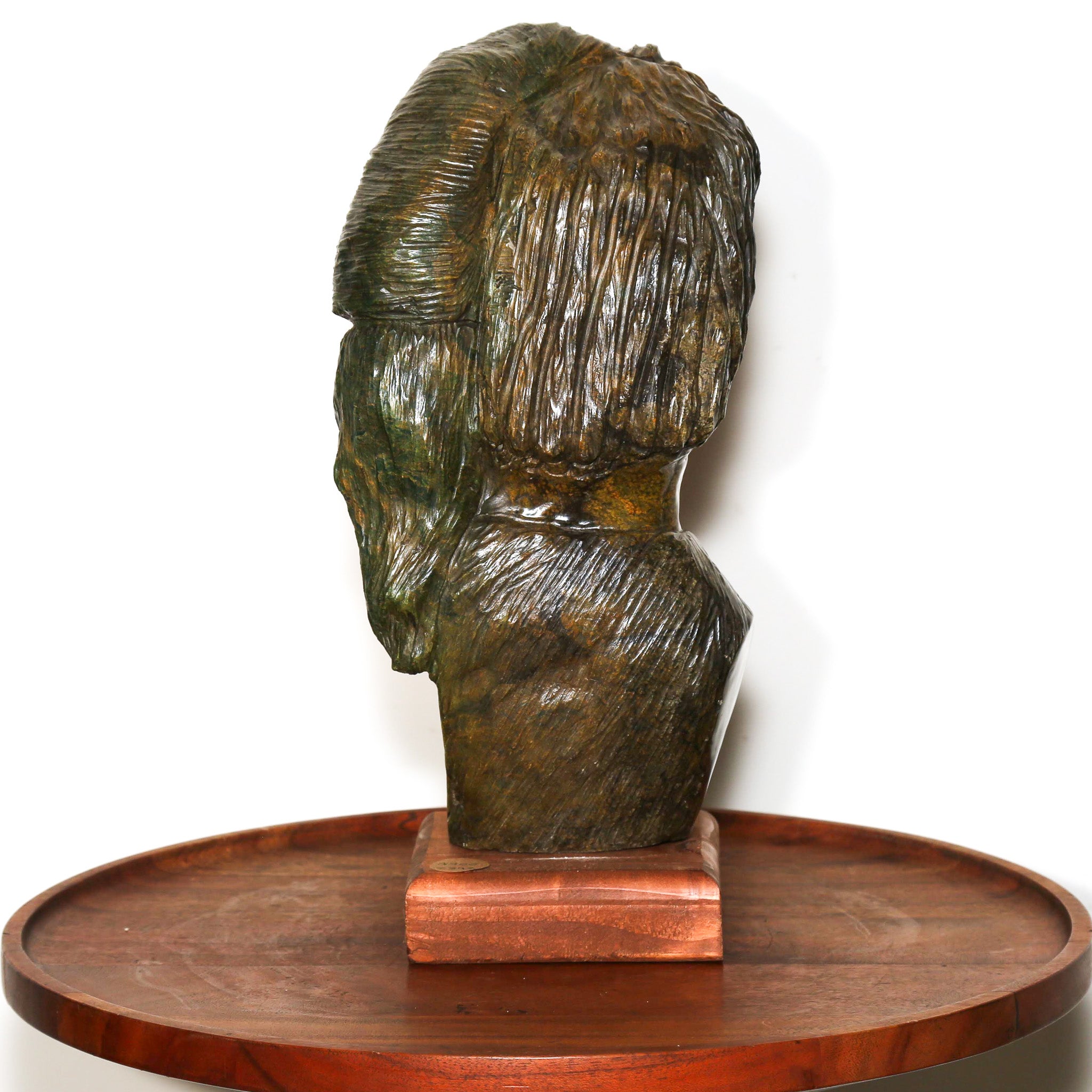Green stone statue of a man