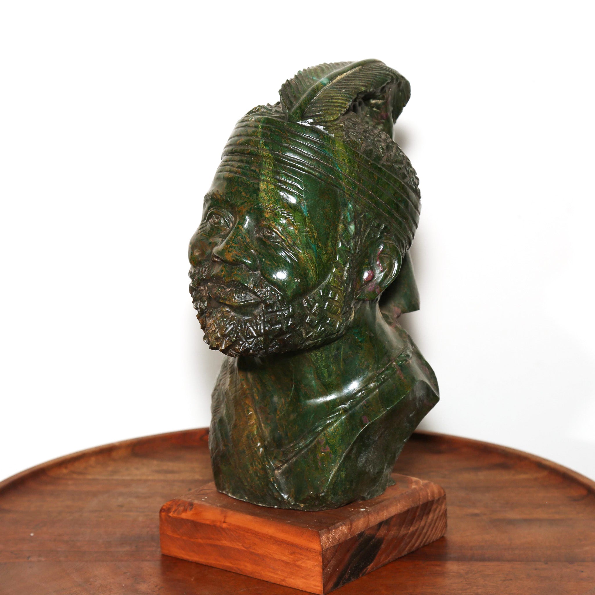 carving of an old tribal leader in africa