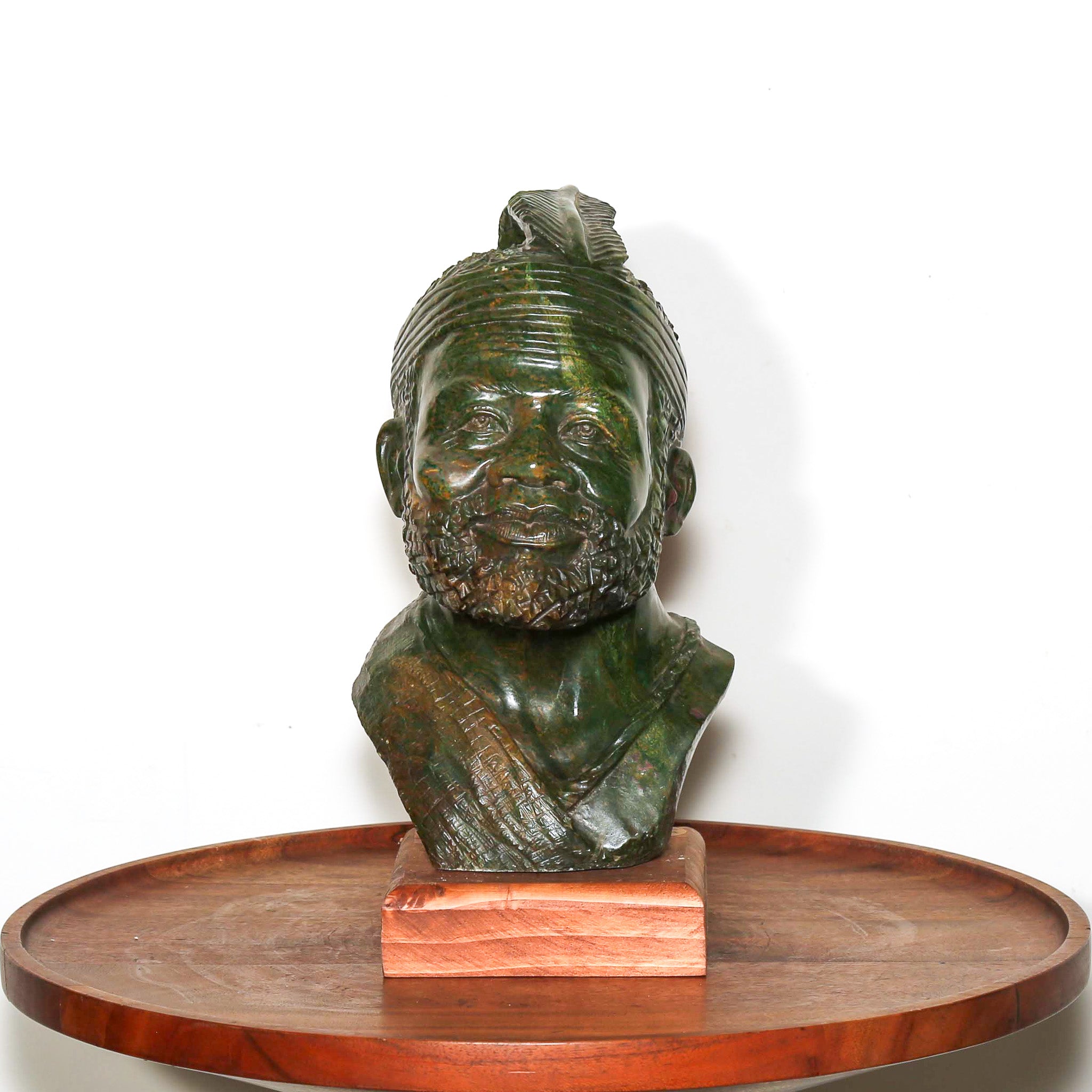 carving of an old tribal leader in africa