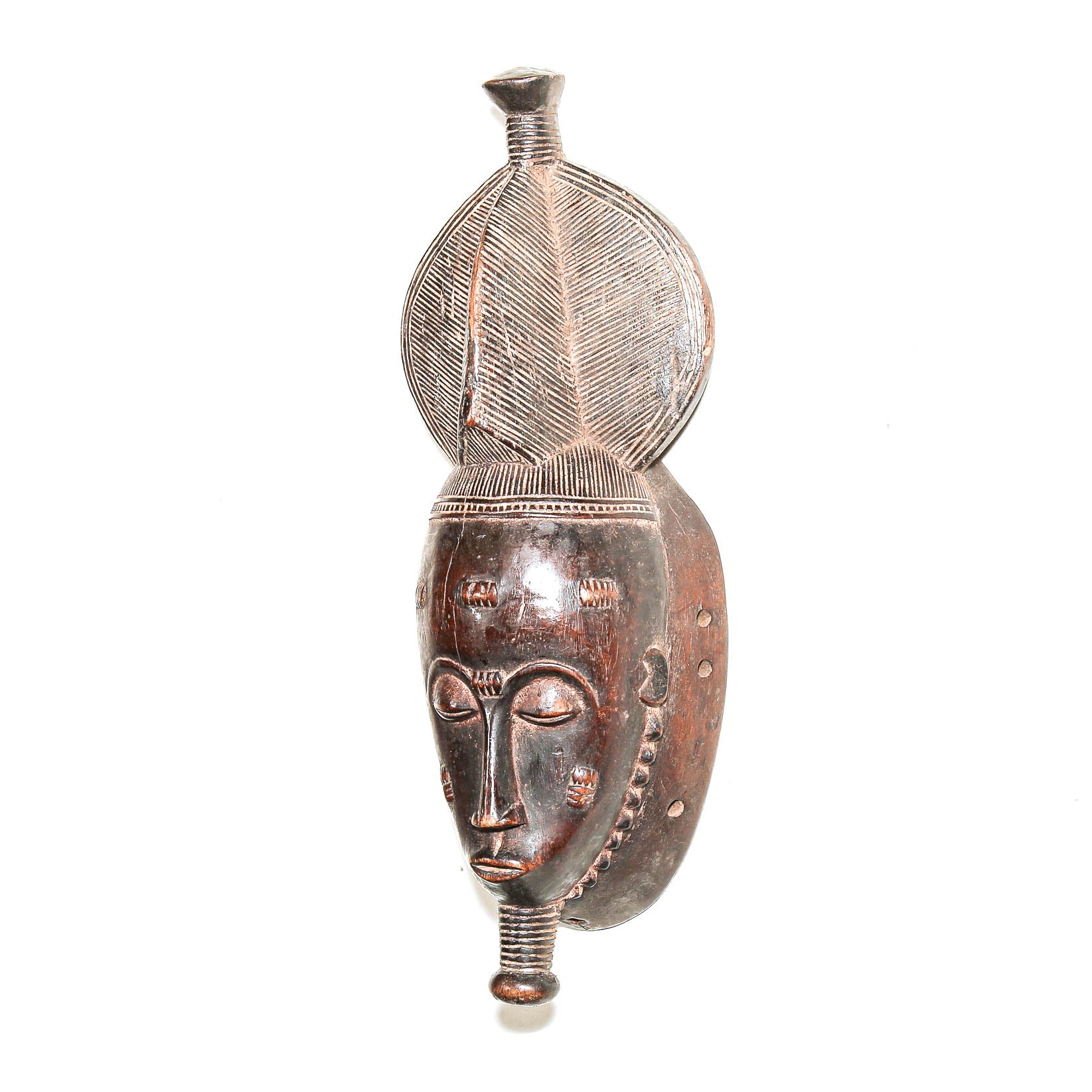 Small hand-carved African mask with brown wood finish