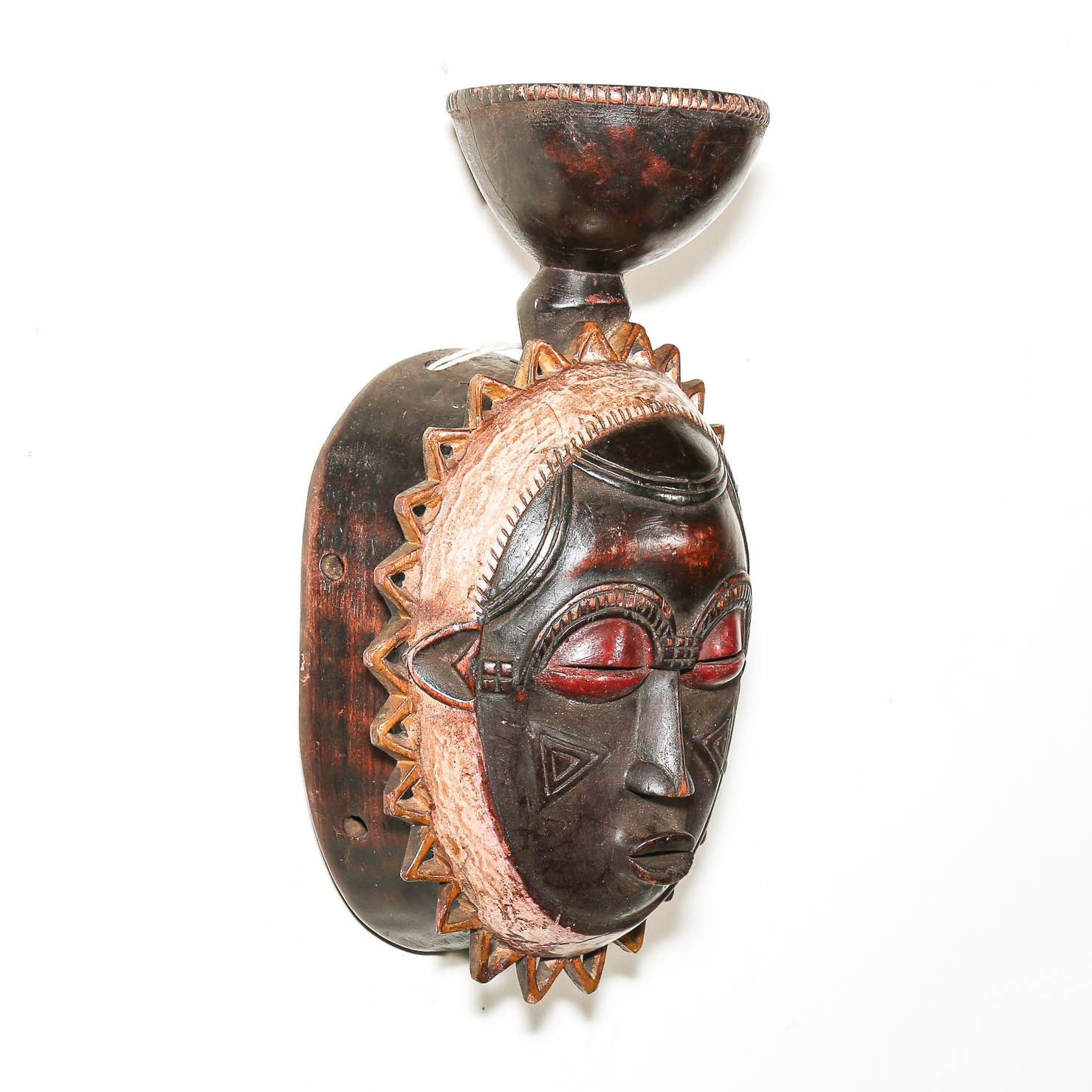 West African Baule mask with radiating sun design