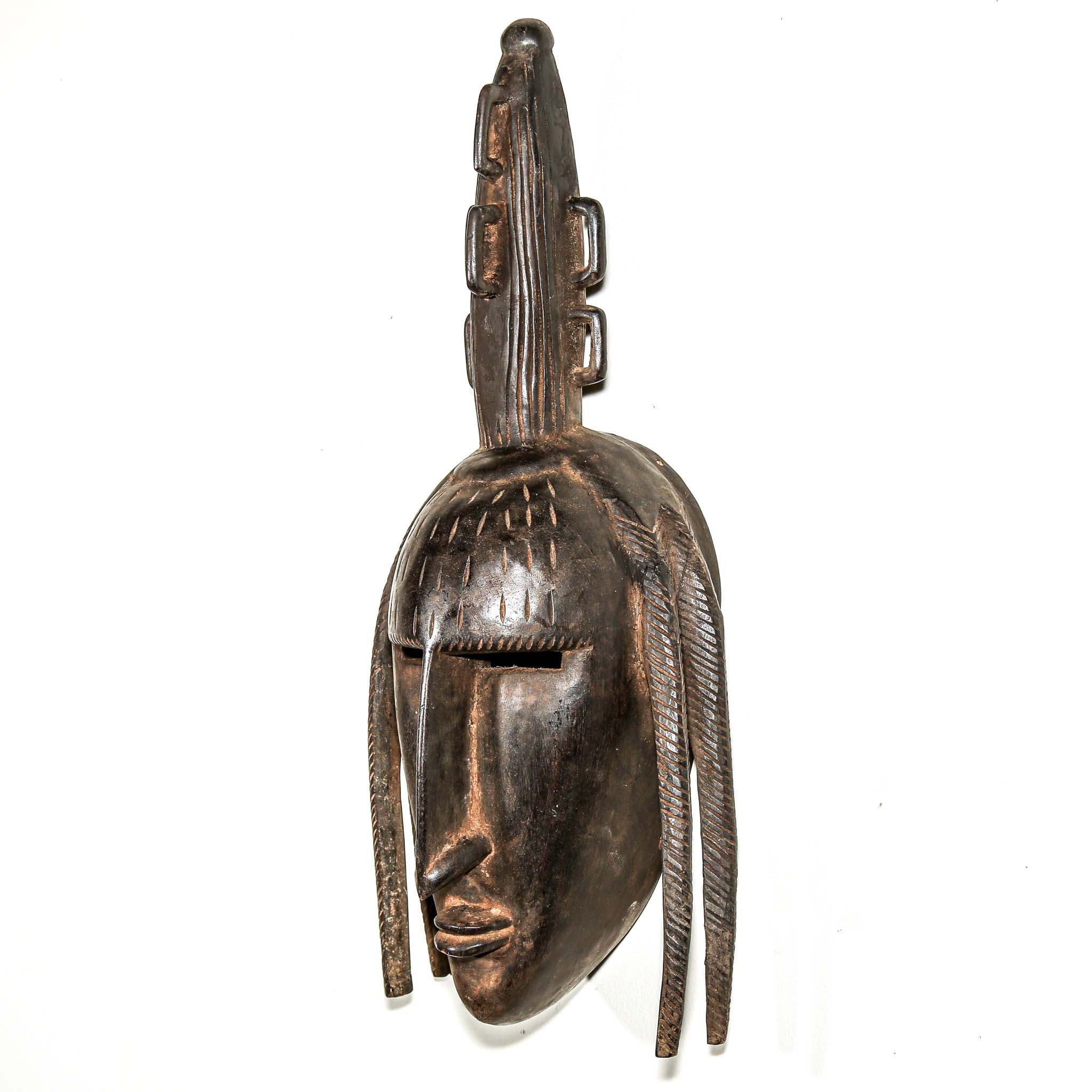 finely carved wooden modern african wall mask. Home and living room decor to hang on the wall