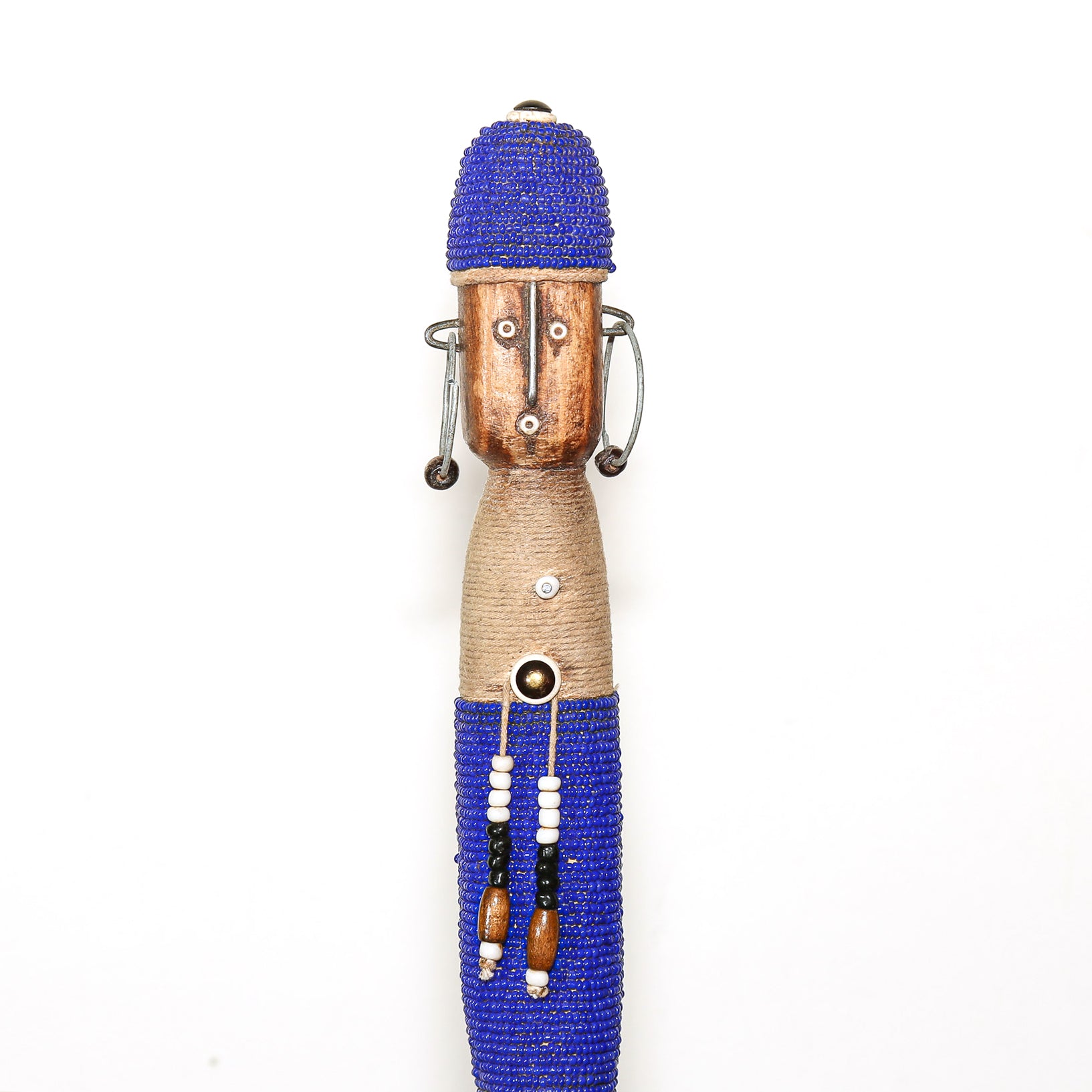 A handmade African-style wooden doll figurine with a blue beaded hat, natural wood face, wrapped torso, and blue beaded skirt, set against a plain white background.