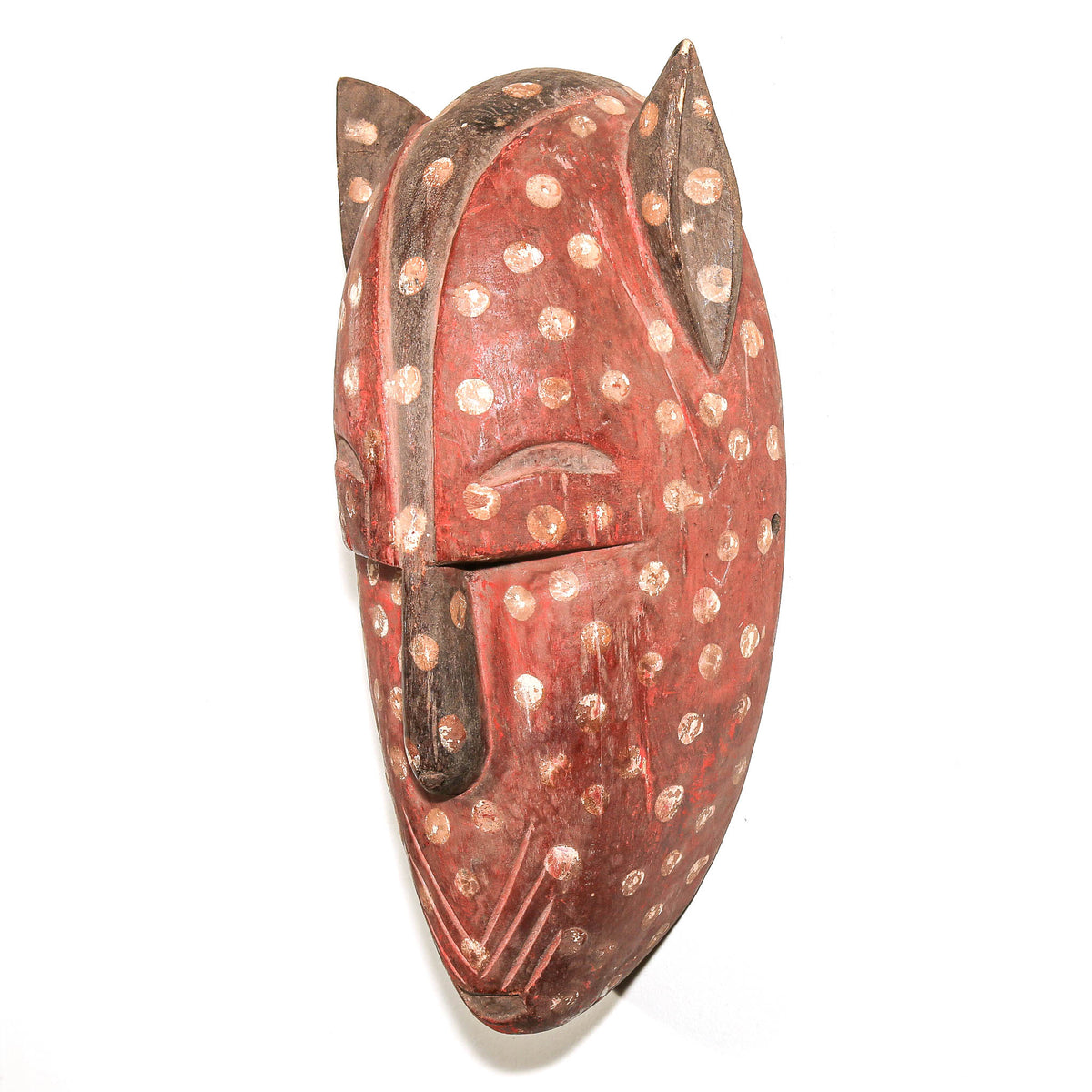 Carved Bamana feline mask from Mali featuring an expressive cat face and distinctive traditional African art form