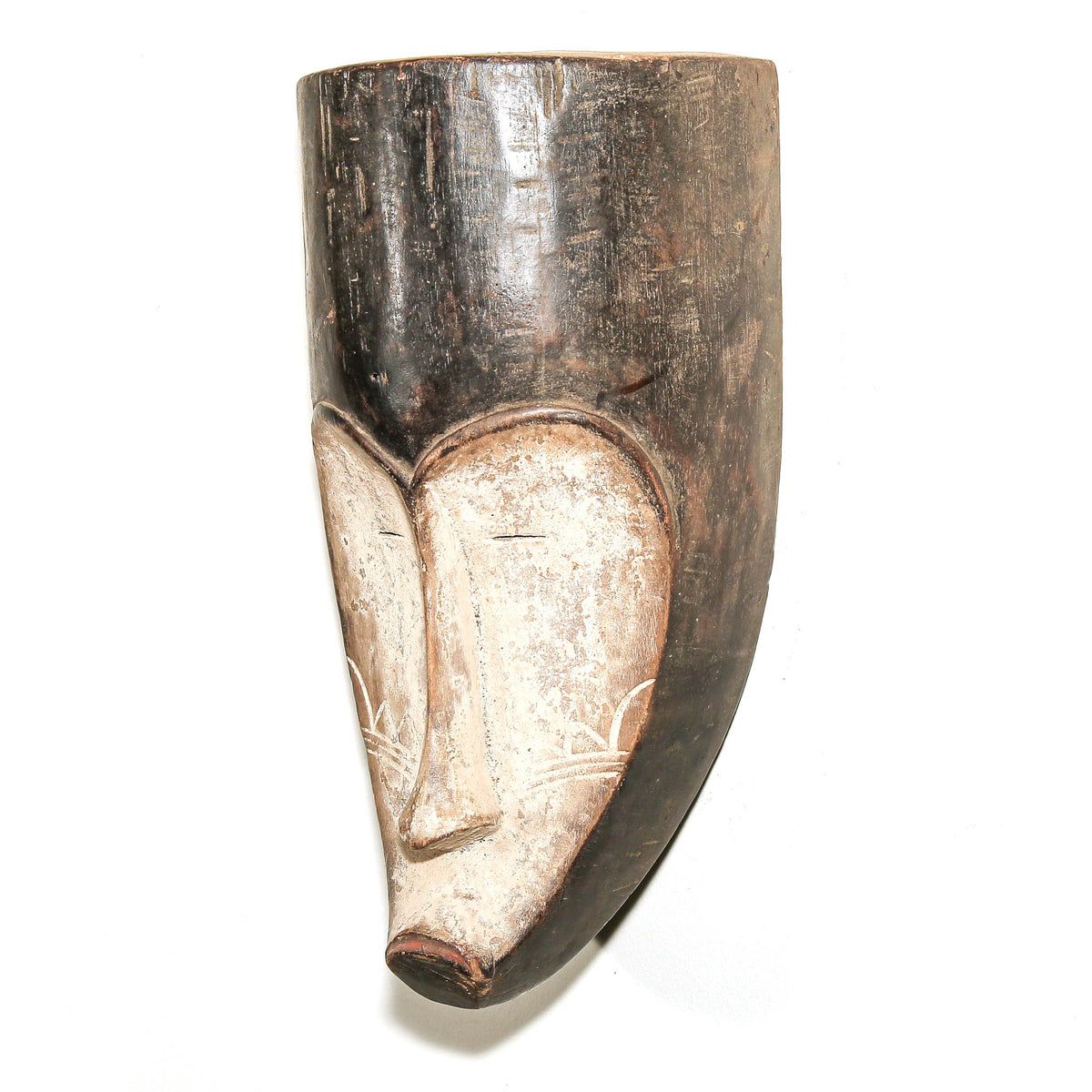 Hand-carved Fang face mask in black and white with strong contrast, refined features, and classic regional design