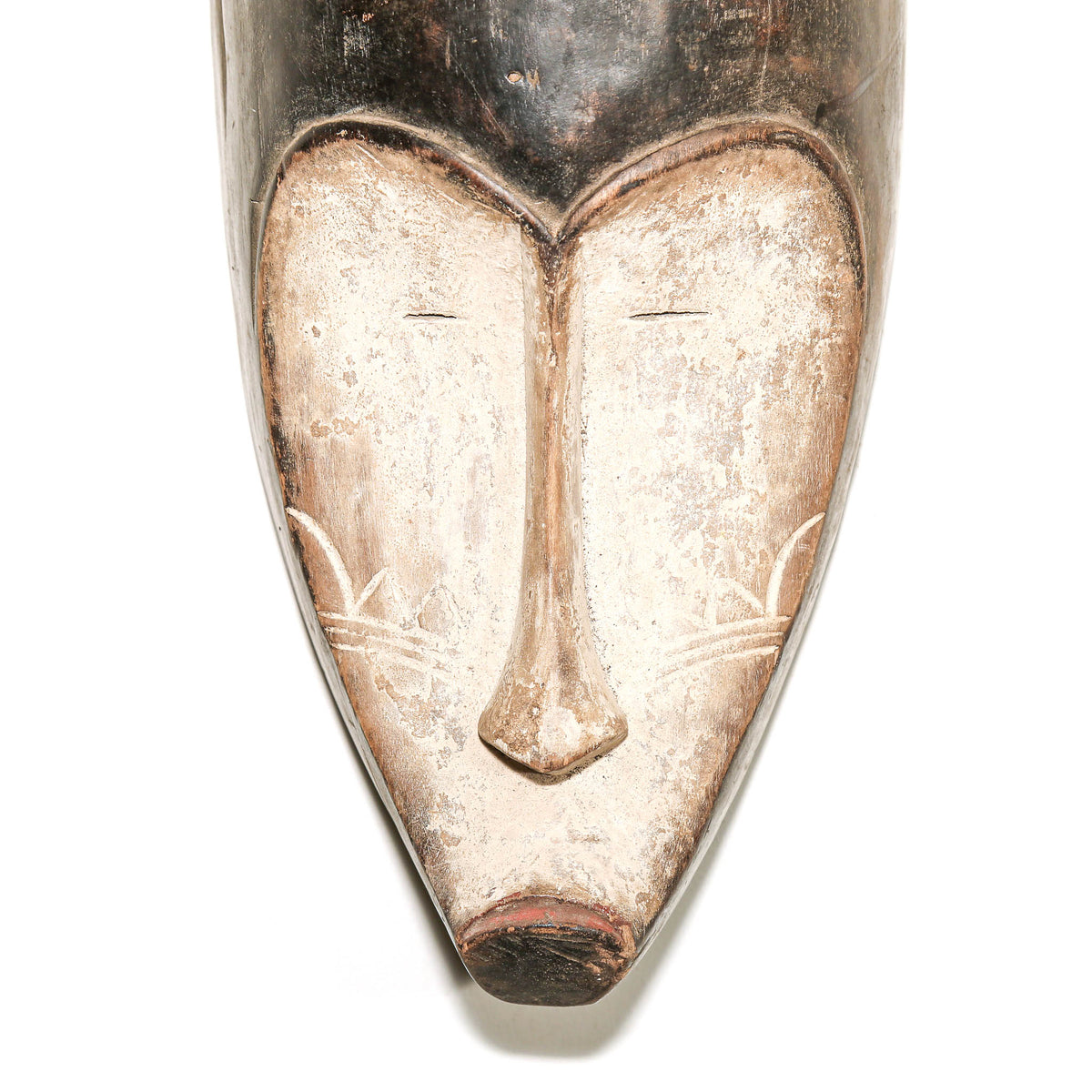 Collectible black and white Fang mask displayed as Central African art with carved details and dramatic visual presence