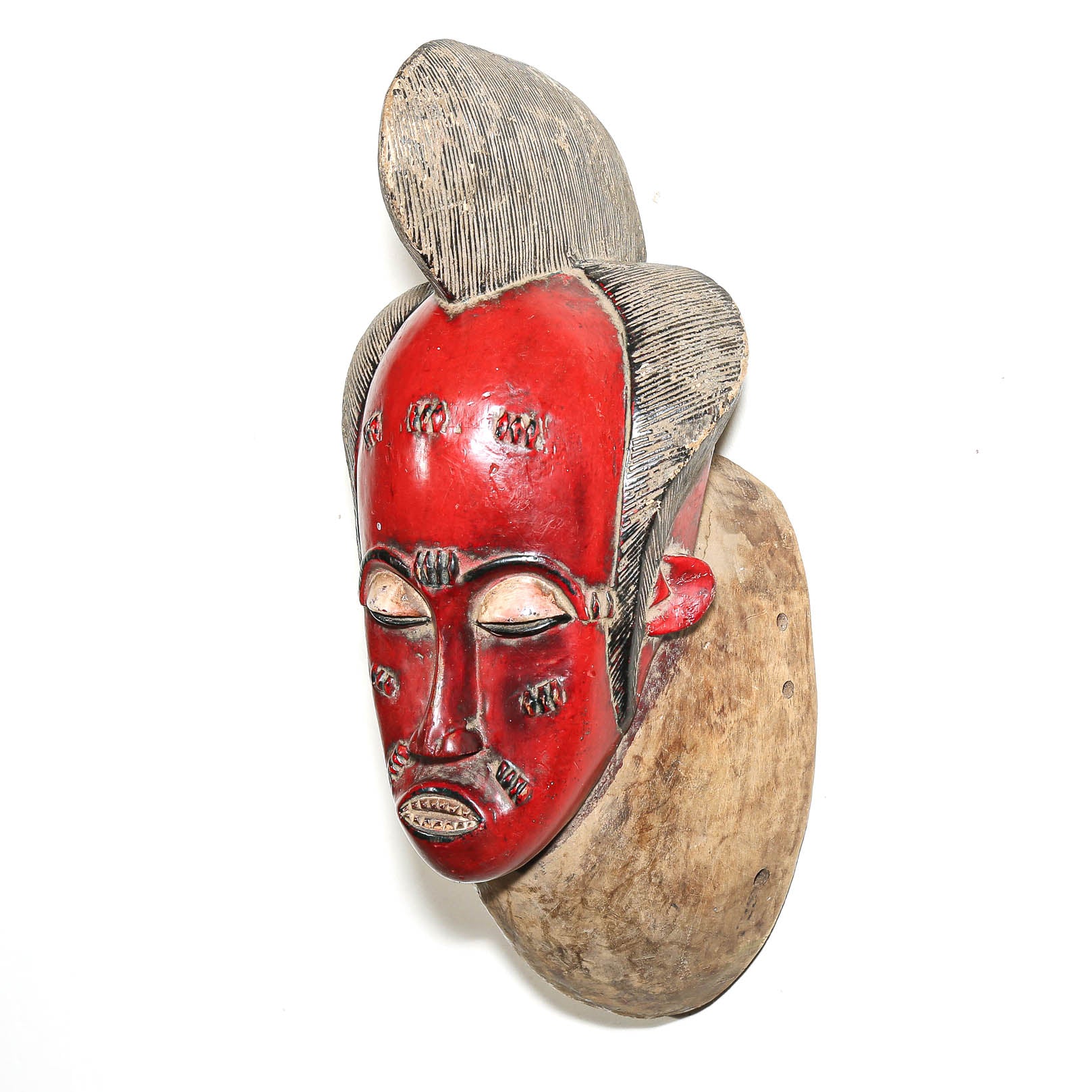 Red wooden Baule mask from West Africa
