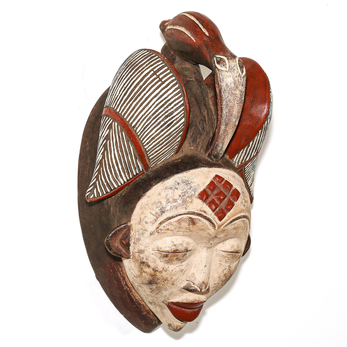 Oversized Punu African mask from Gabon featuring a sculptural face and finely carved traditional details
