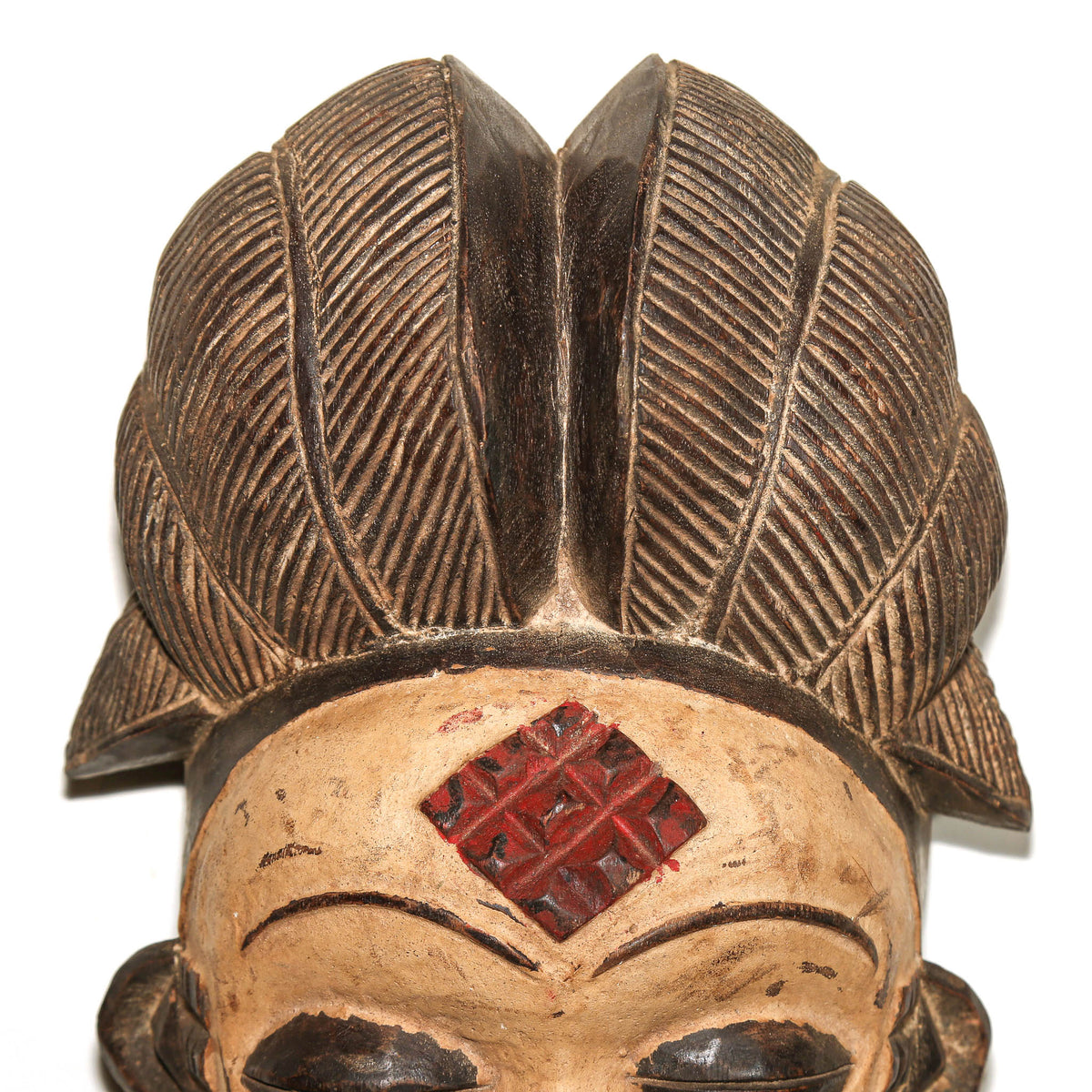 Large Gabonese Punu ceremonial mask with graceful facial features, carved wood construction, and impressive decorative presence