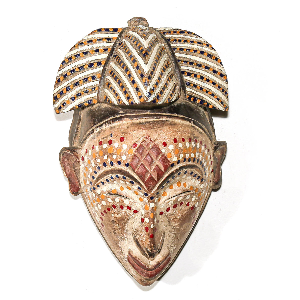 Unique dotted Punu mask from Gabon with refined carved facial features and decorative surface patterning