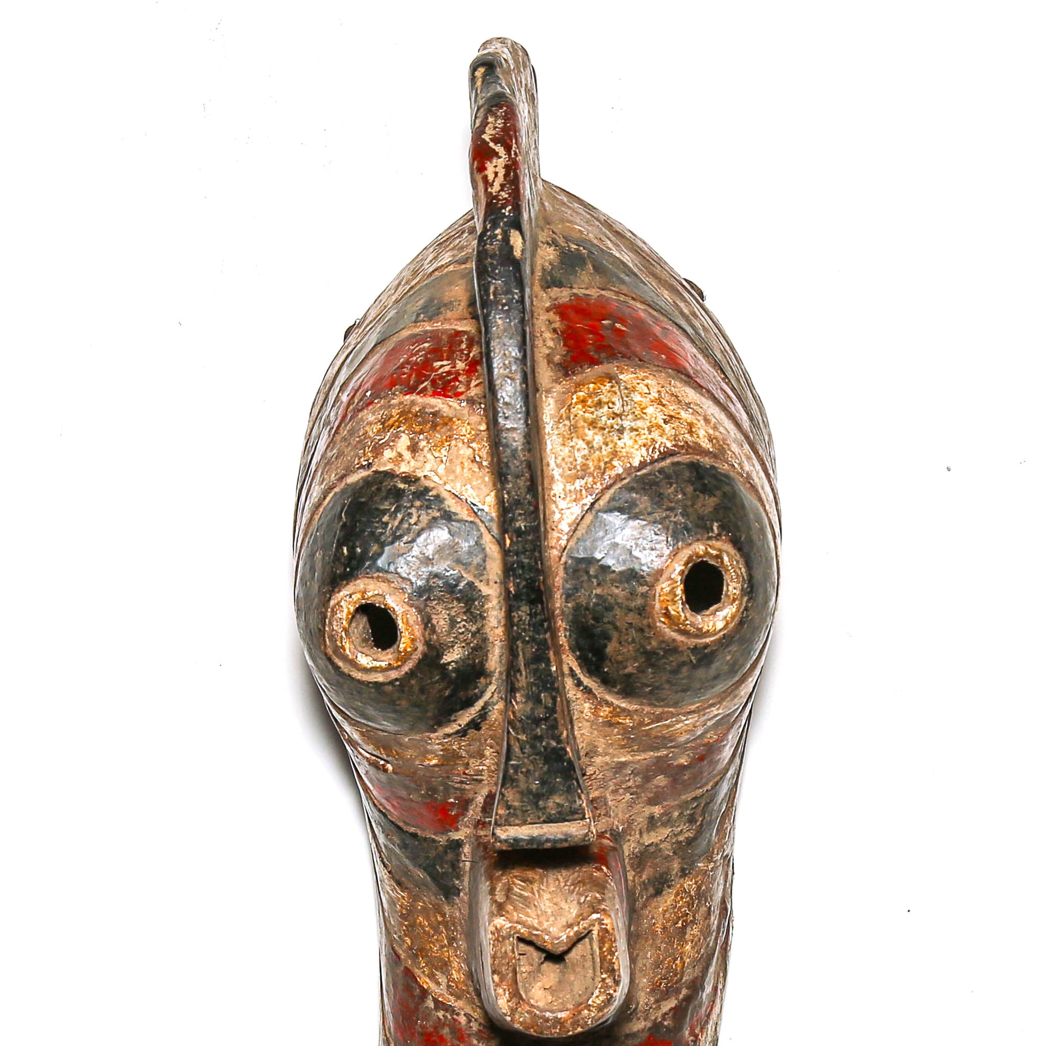 Decorative mask with metallic and red accents on a white background