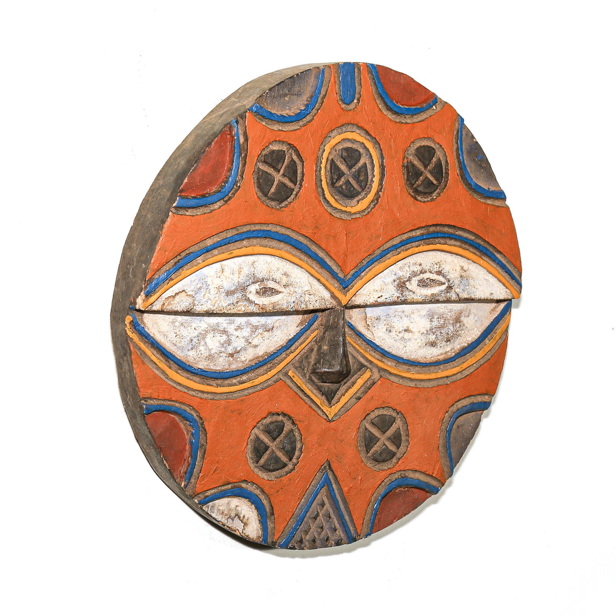 Traditional Teke African mask featuring bright colors, graphic facial details, and strong geometric decoration