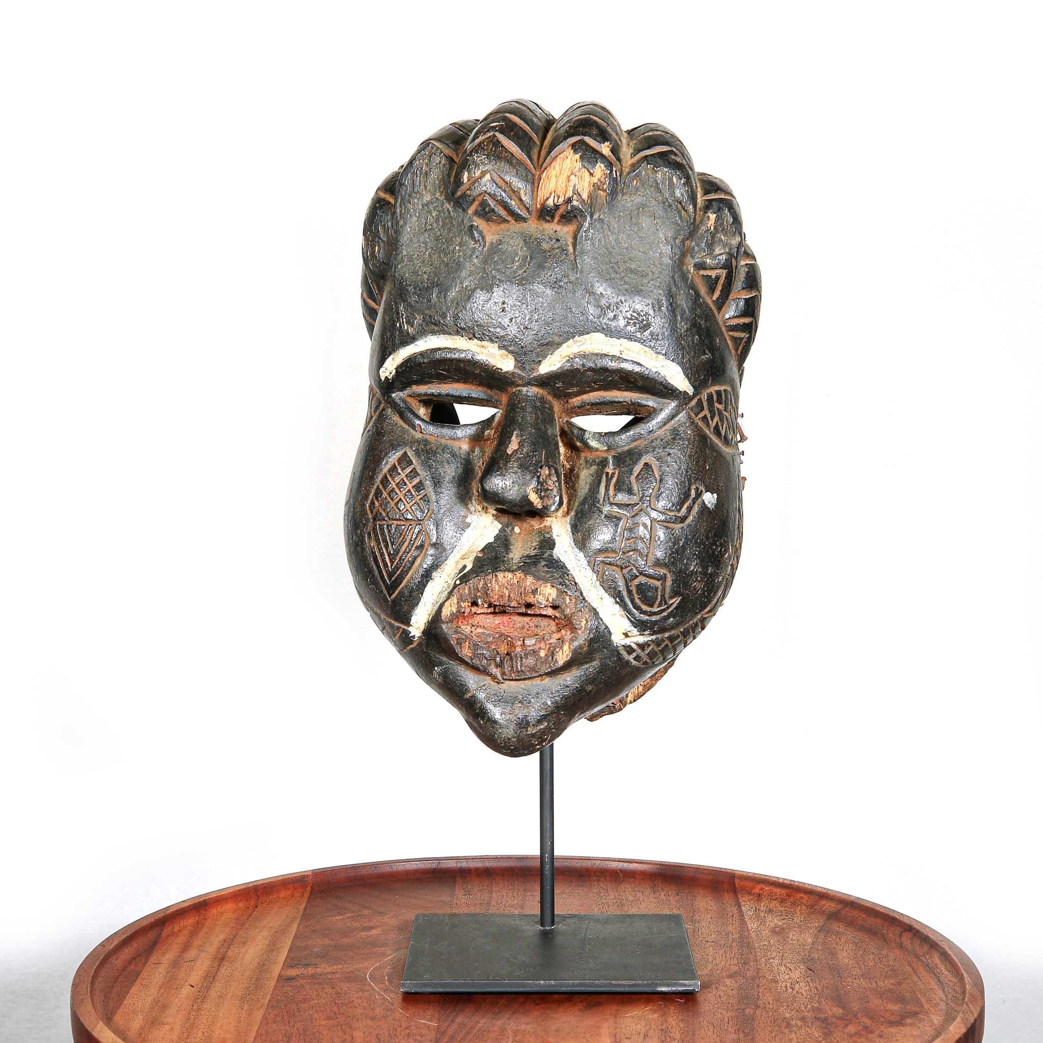 Ibibio Mask from Nigeria skewed on a stand