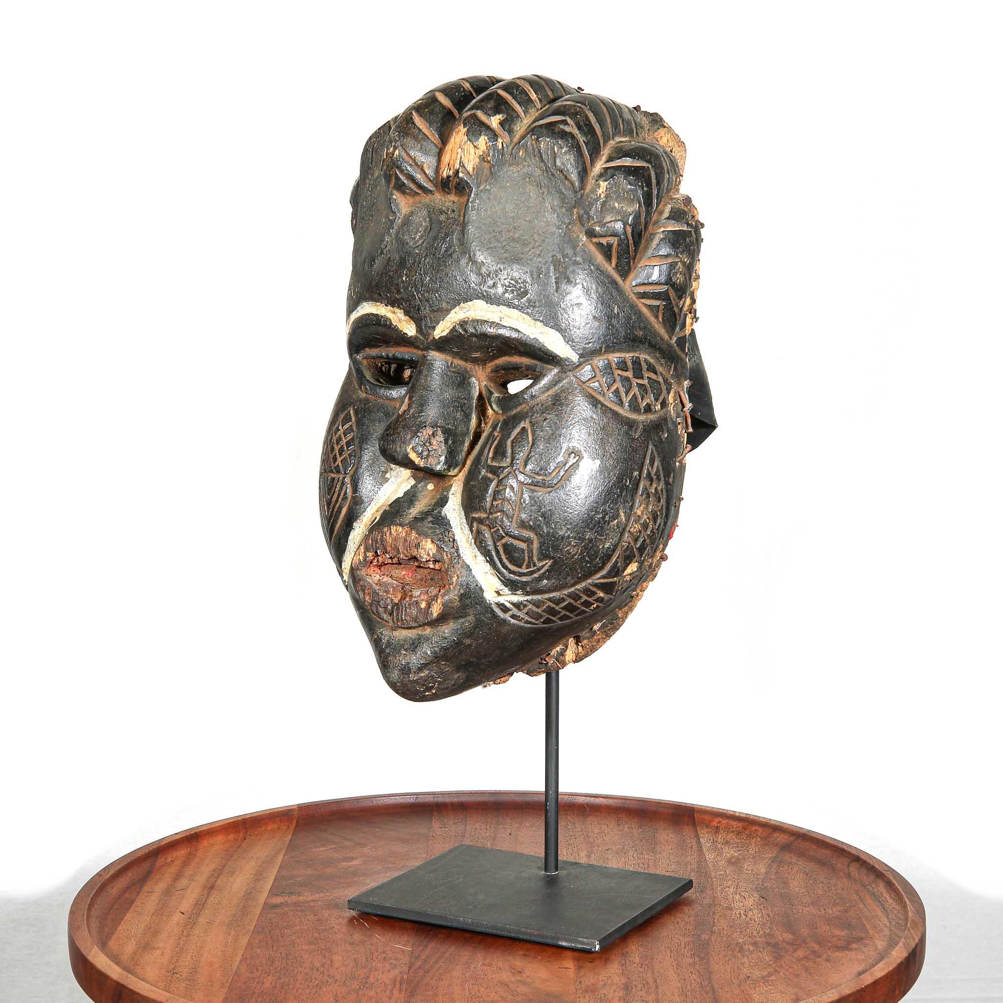 Ibibio Mask from Nigeria on a stand