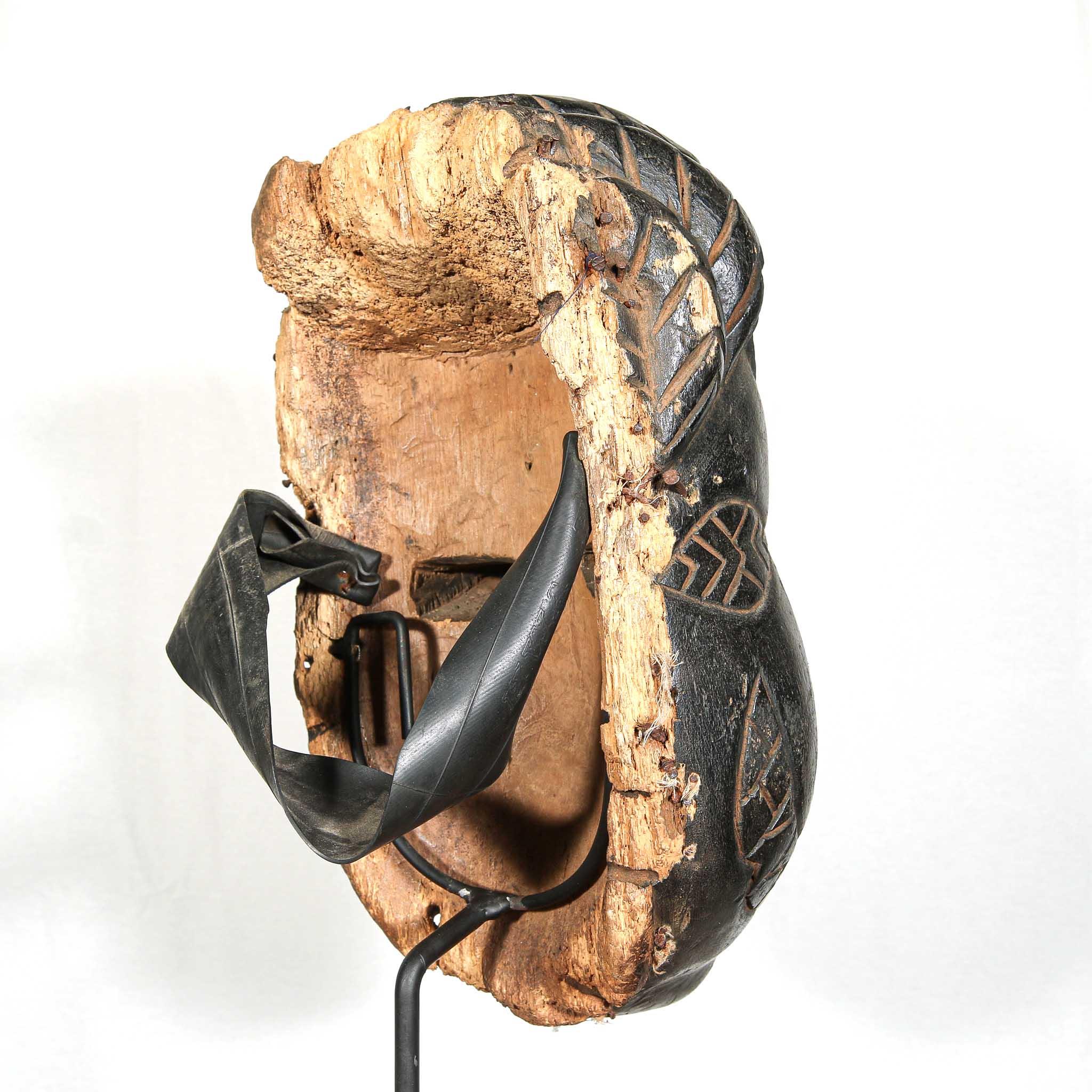 Ibibio Mask from Nigeria skewed back on a stand
