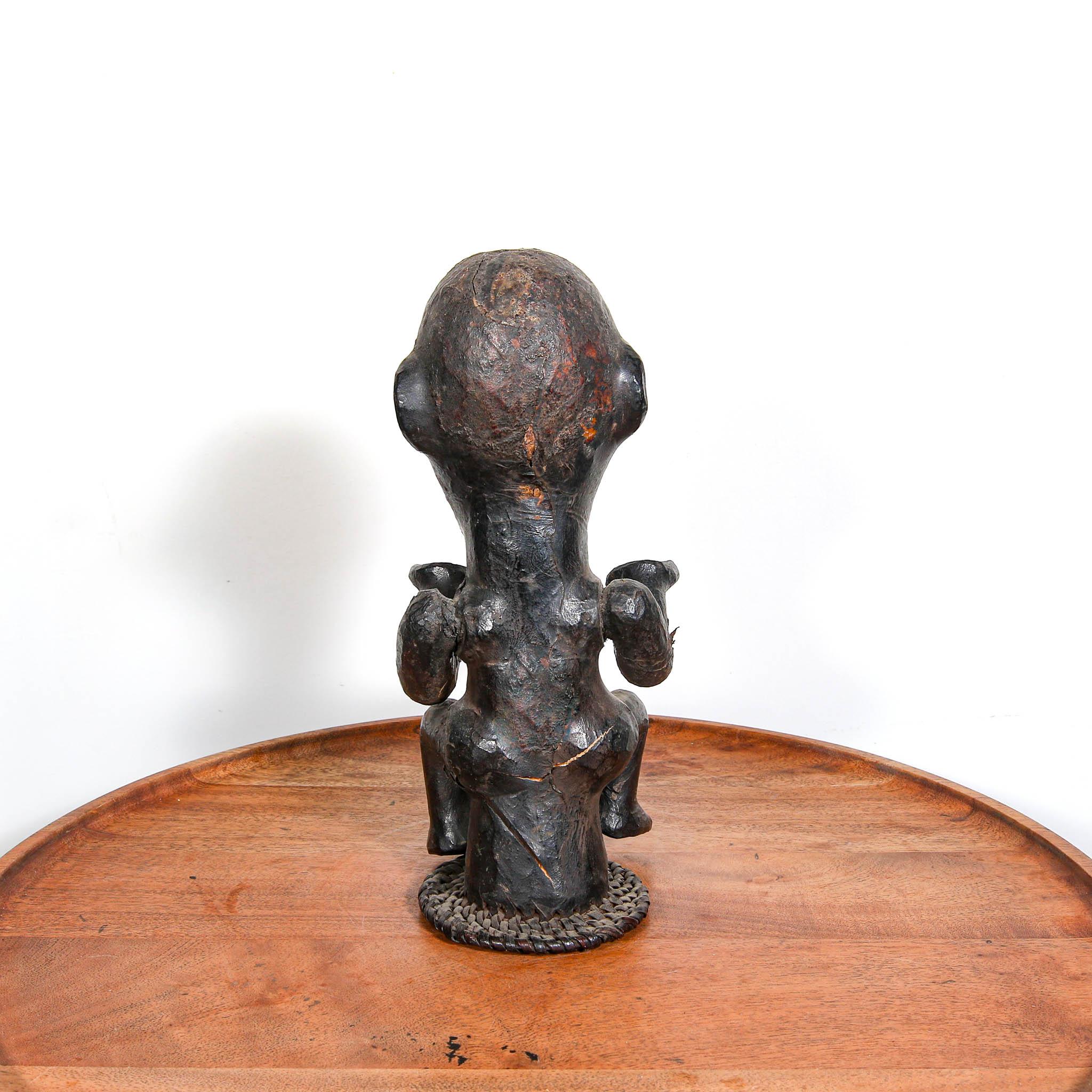 Ekoi Headdress from Nigeria an authentic ceremonial art from Africa on a table showing back
