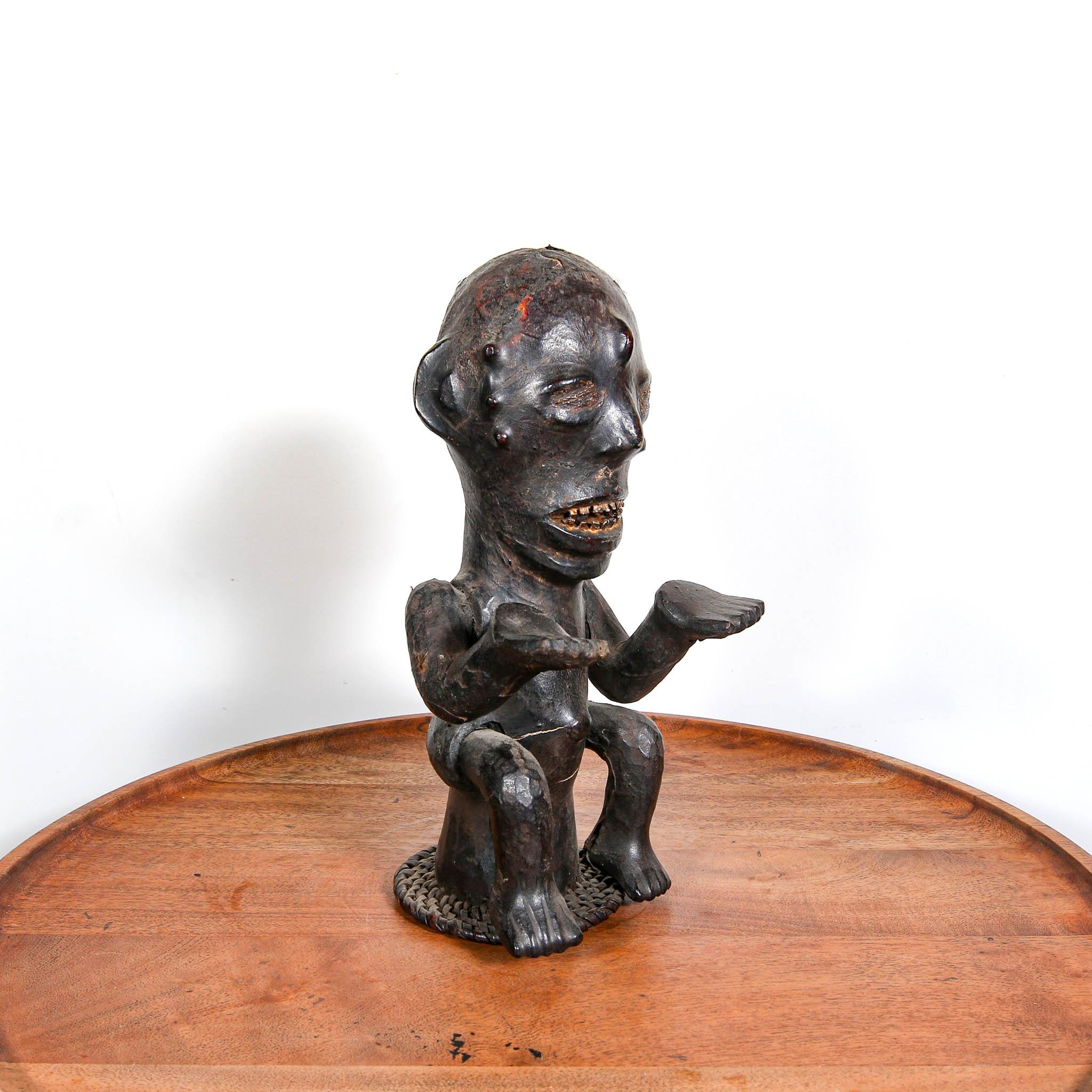 Ekoi Headdress, Nigeria an authentic ceremonial art from Africa on a table skewed to the left