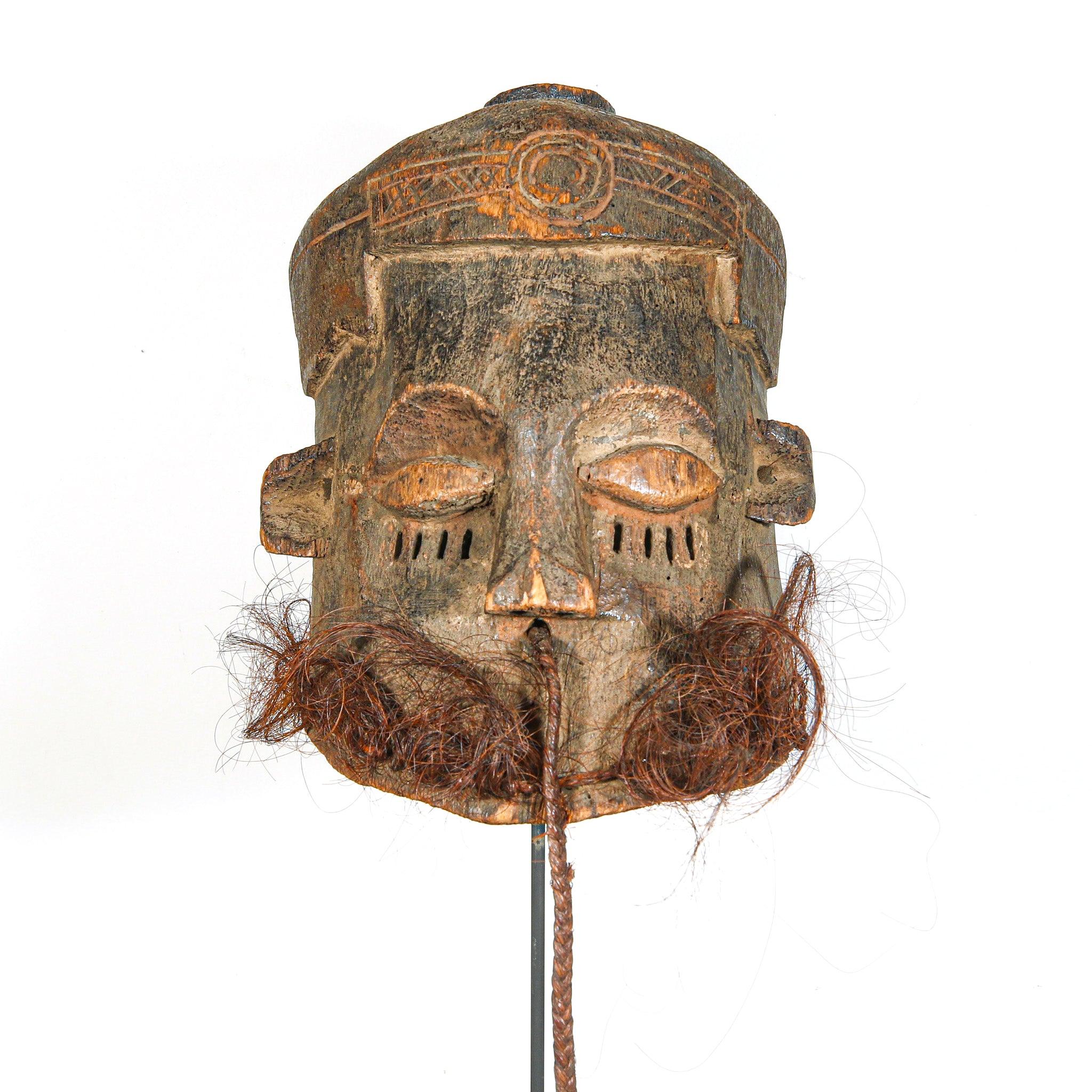 Kuba Binji Helmet Mask from D.R. Congo on a stand showing front side