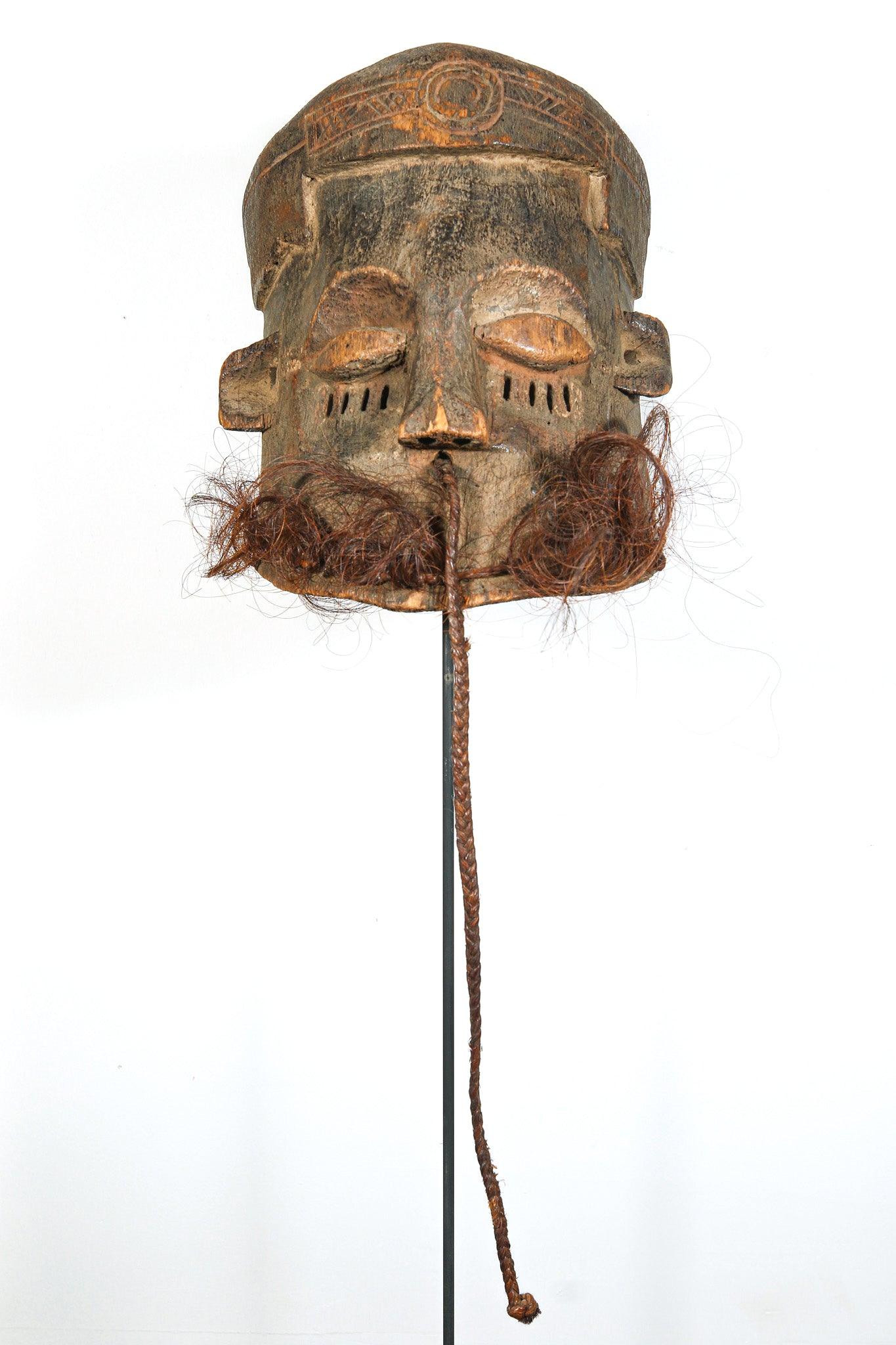 Kuba Binji Helmet Mask from D.R. Congo on a stand showing front side and whole braid