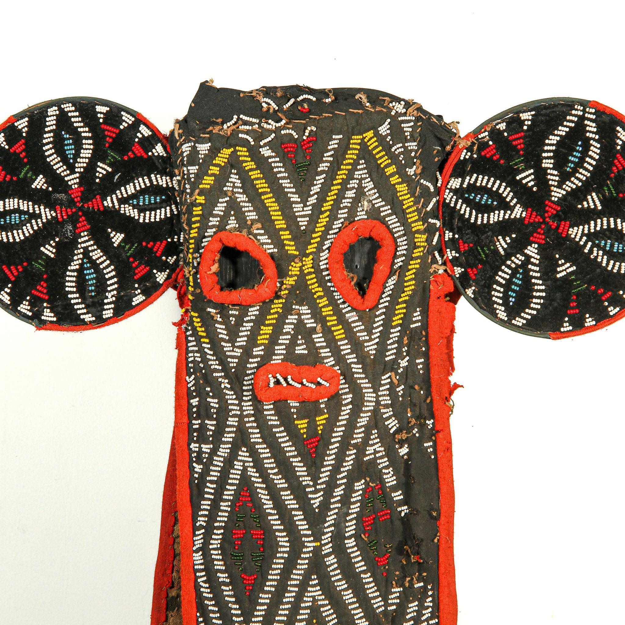 Bamileke Beaded Elephant Kuosi Mask from Cameroon on a stand showing front side with a close up on the African masks face