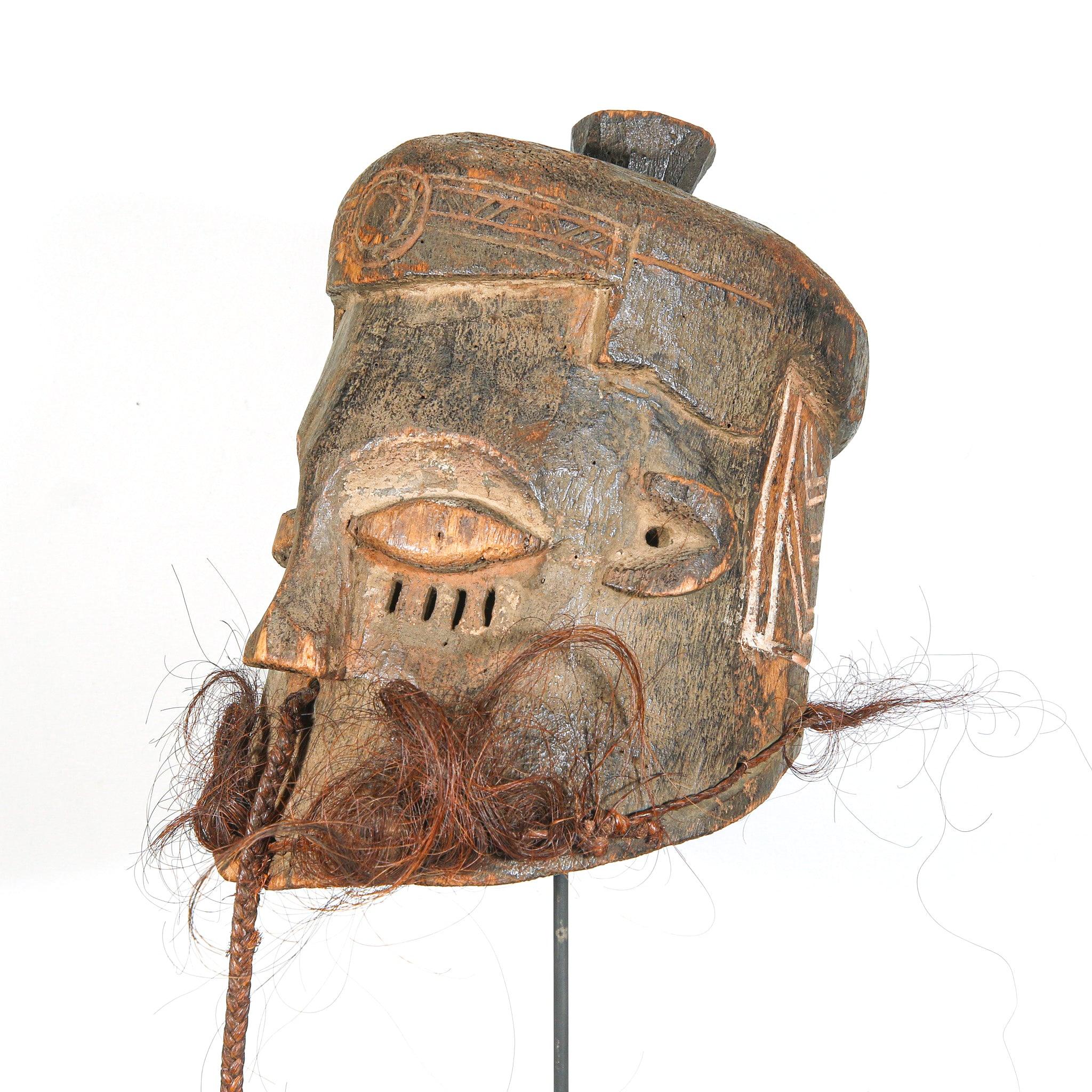 Kuba Binji Helmet Mask from D.R. Congo on a stand showing left side