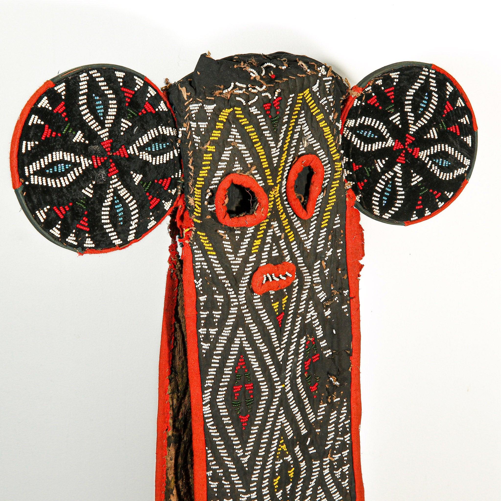 Bamileke Beaded Elephant Kuosi Mask from Cameroon on a stand skewed to the right