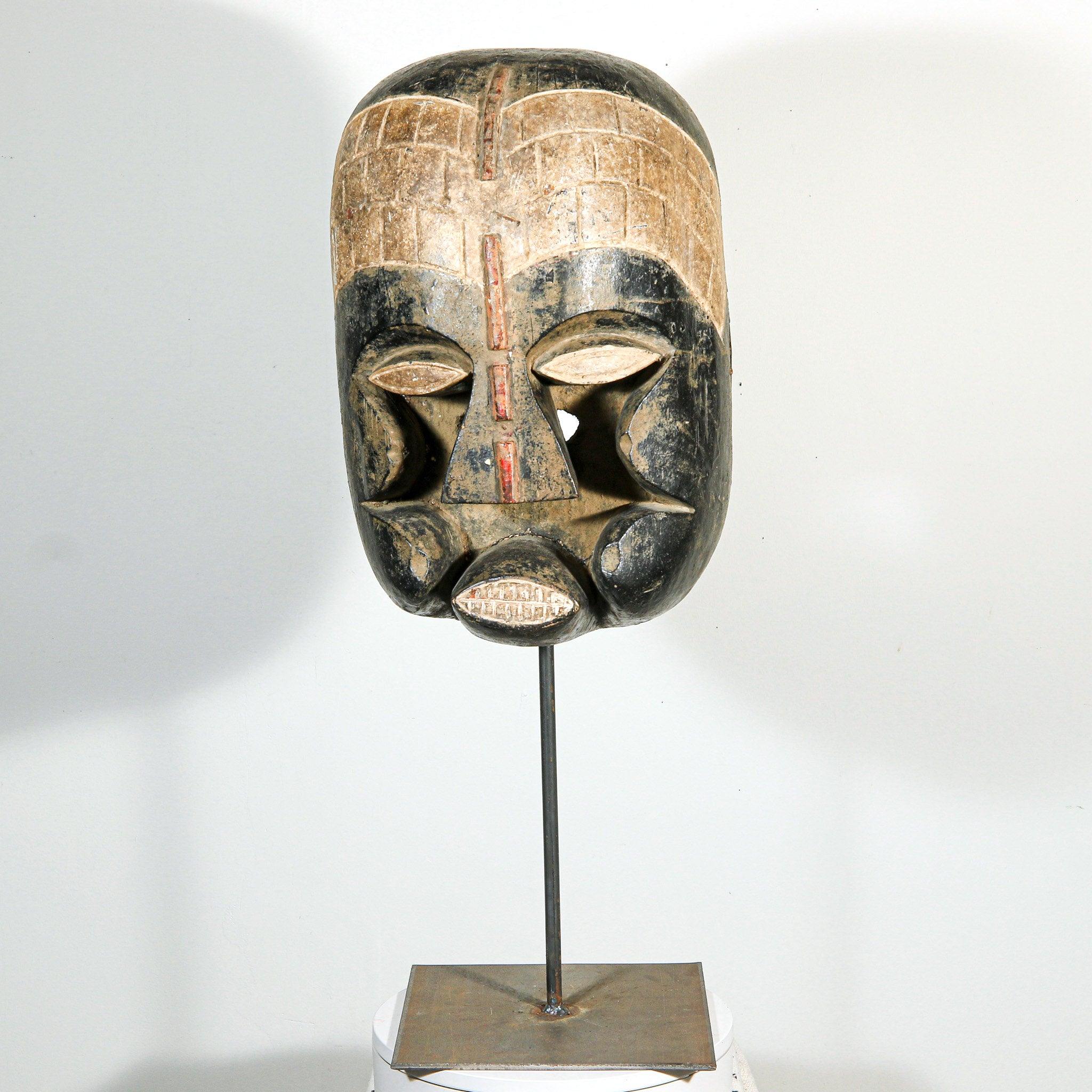 Bozo Puppet Mask from Mali on a stand as a home decor idea showing whole set up