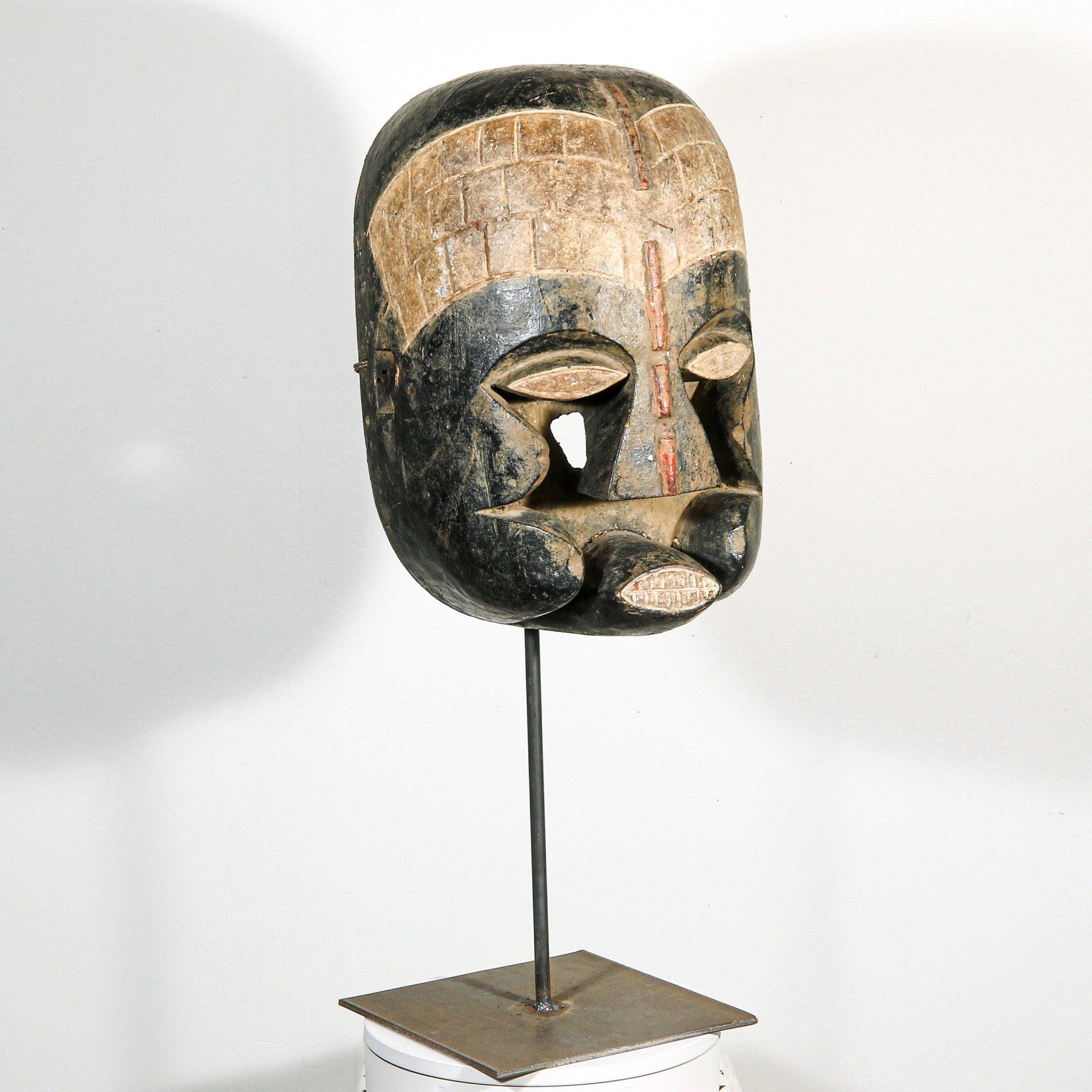 Bozo Puppet Mask from Mali on a stand as a home decor idea in a white room