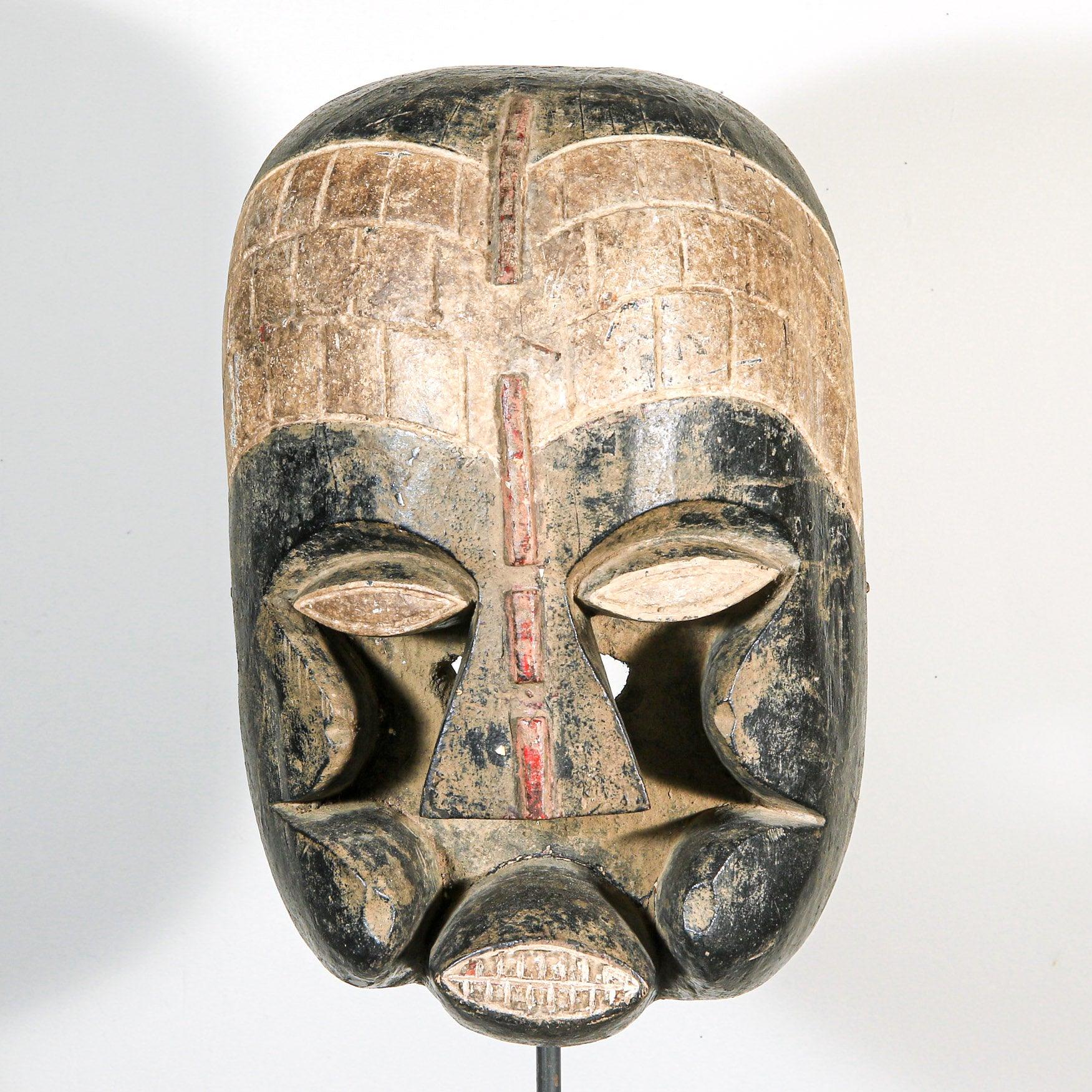 Bozo Puppet Mask from Mali on a stand as a home decor idea showing front side